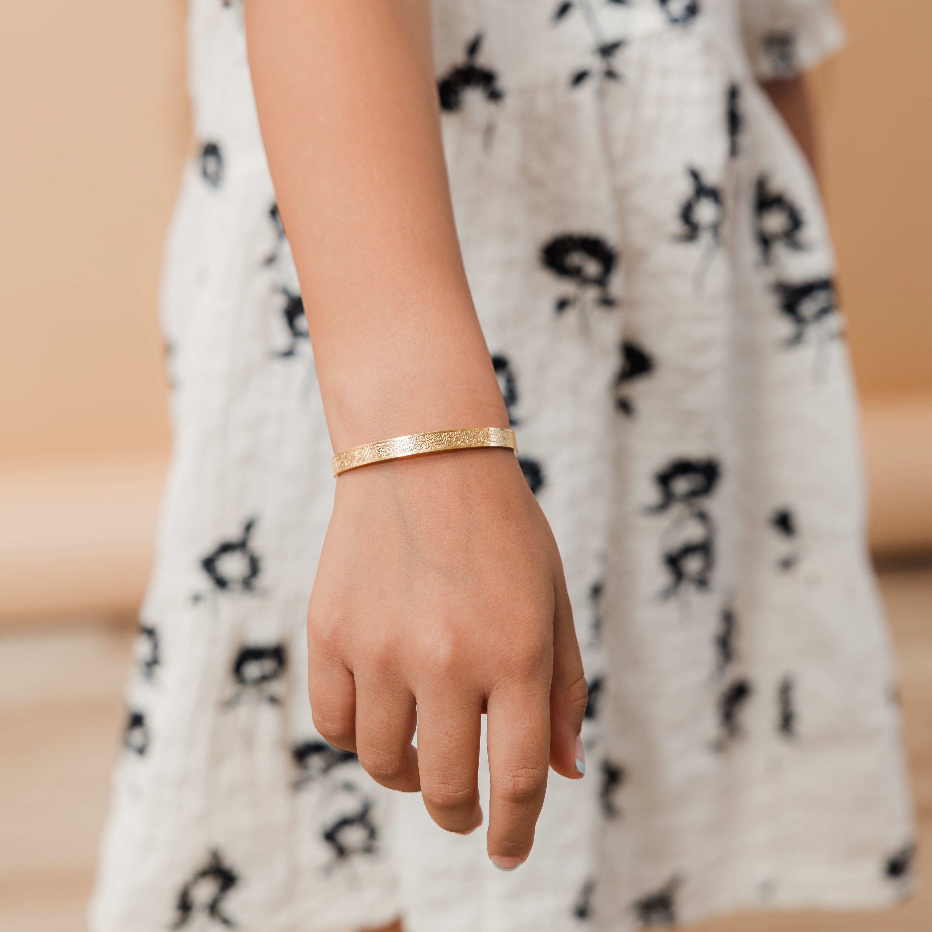Ayatul Kursi cuff displayed in a velvet pouch, emphasizing its elegance and thoughtful packaging.