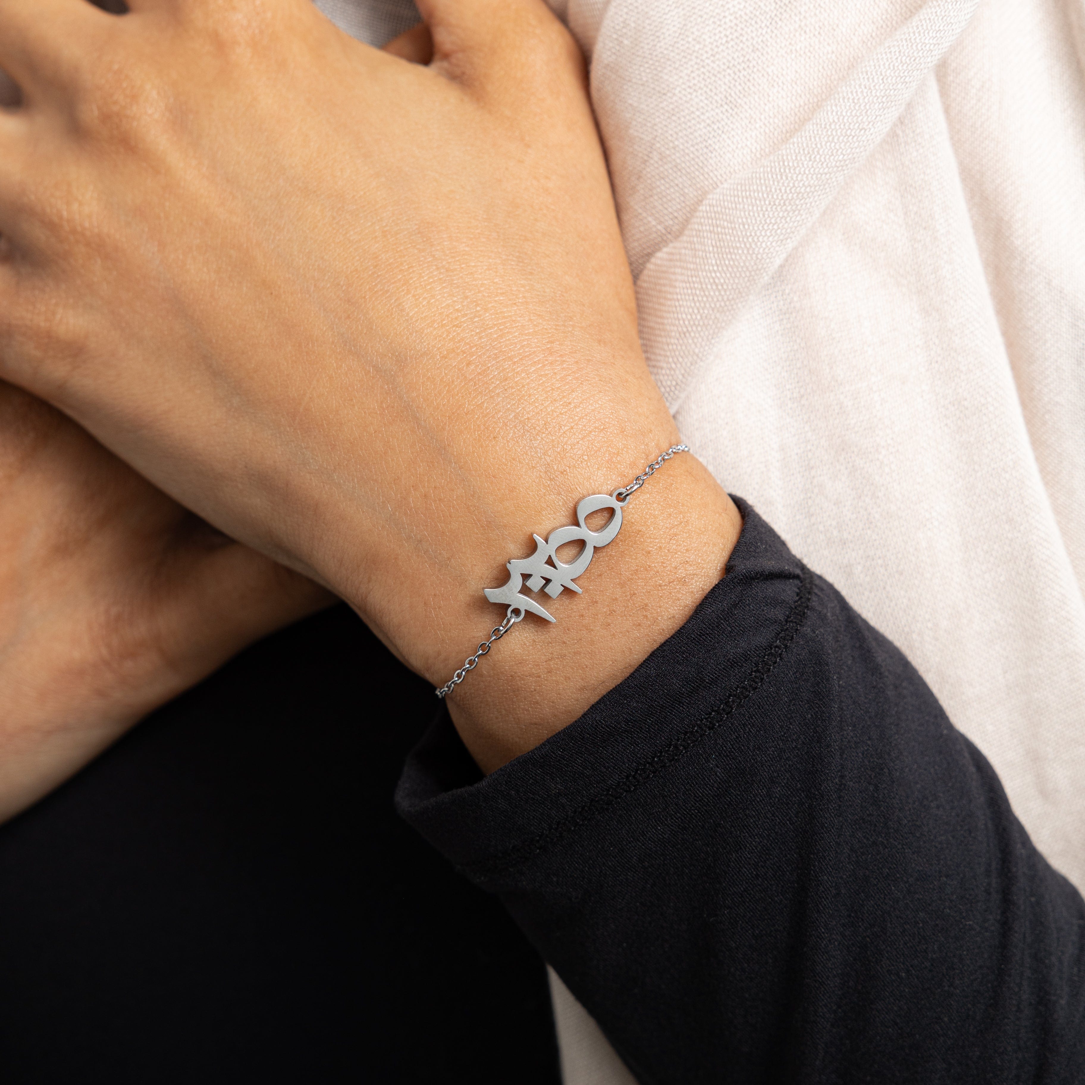 Side view of the gold plated bracelet on a womans wrist, illustrating its elegant design.