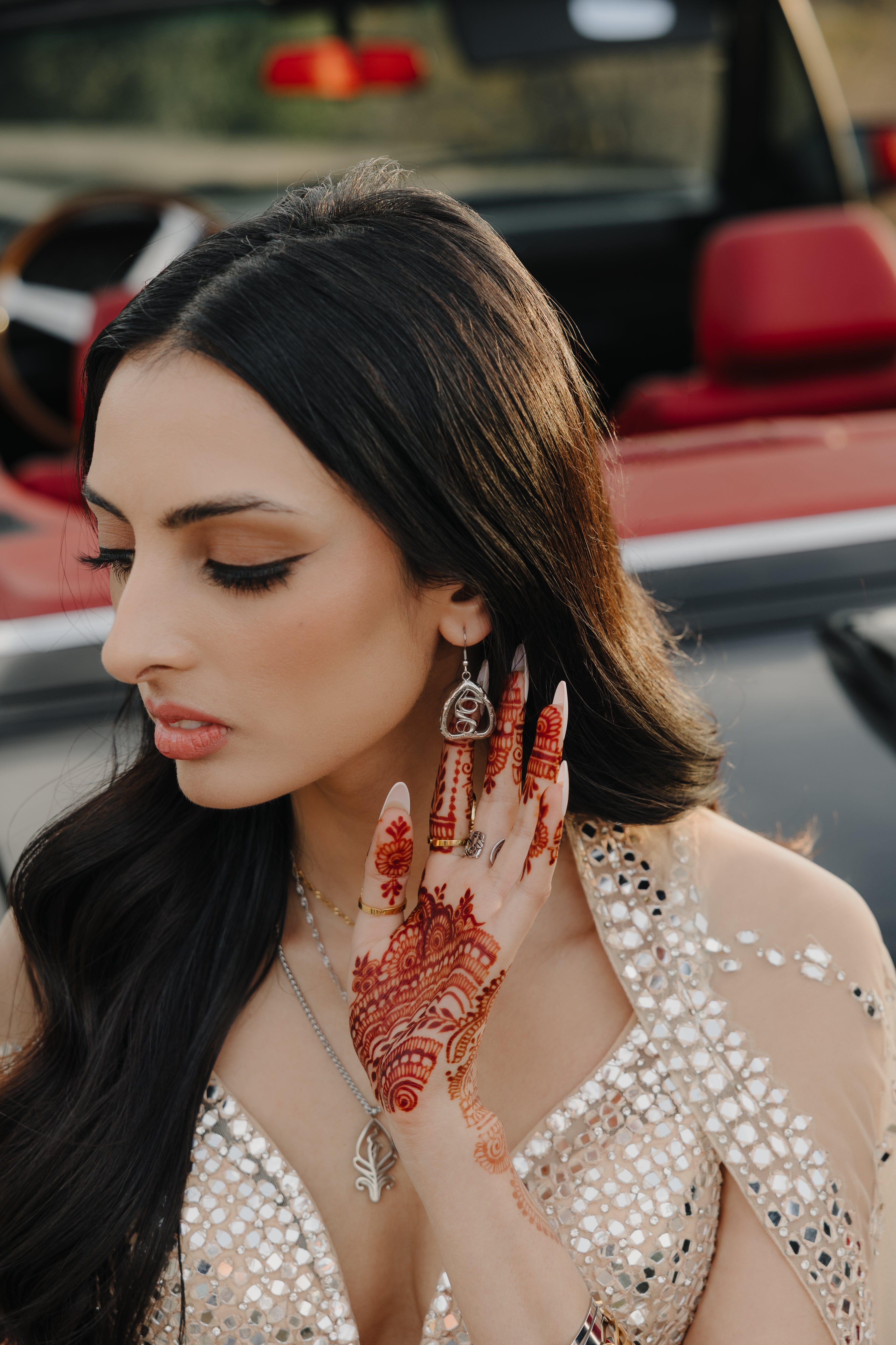 Close-up view of the Heartfelt Arabic Calligraphy Earrings showcasing the intricate design and gold plating.