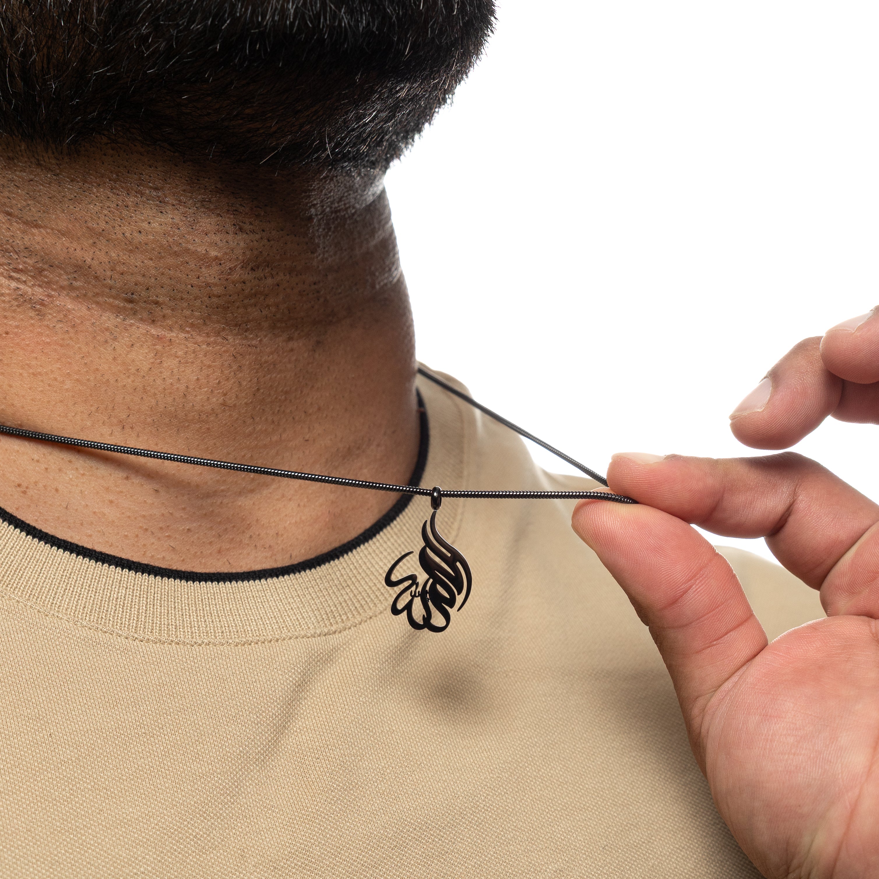 Close-up of the pendant of the Alhamdulillah necklace, highlighting the beautiful calligraphy.