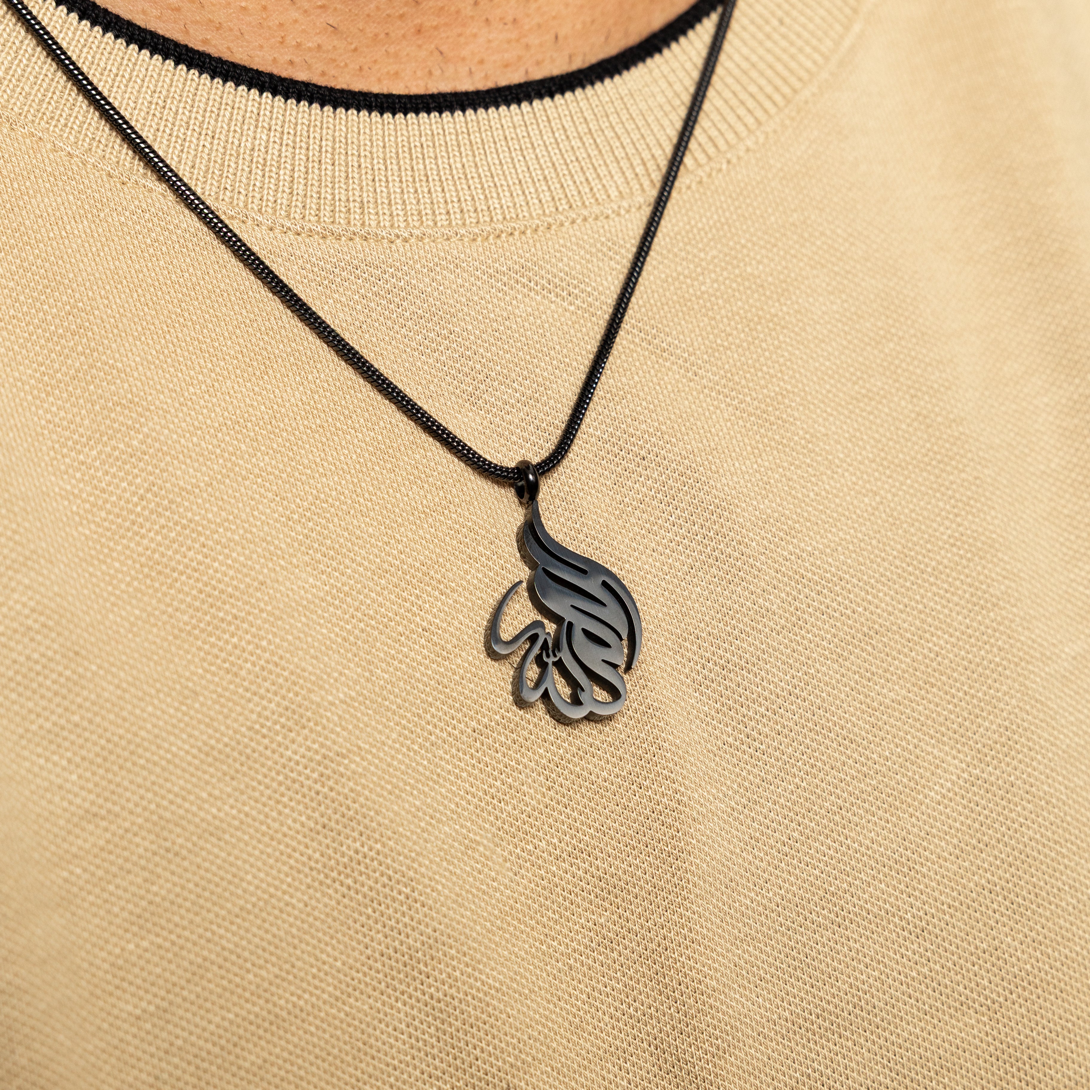 Alhamdulillah necklace displayed in a velvet pouch, emphasizing its gift-ready presentation.
