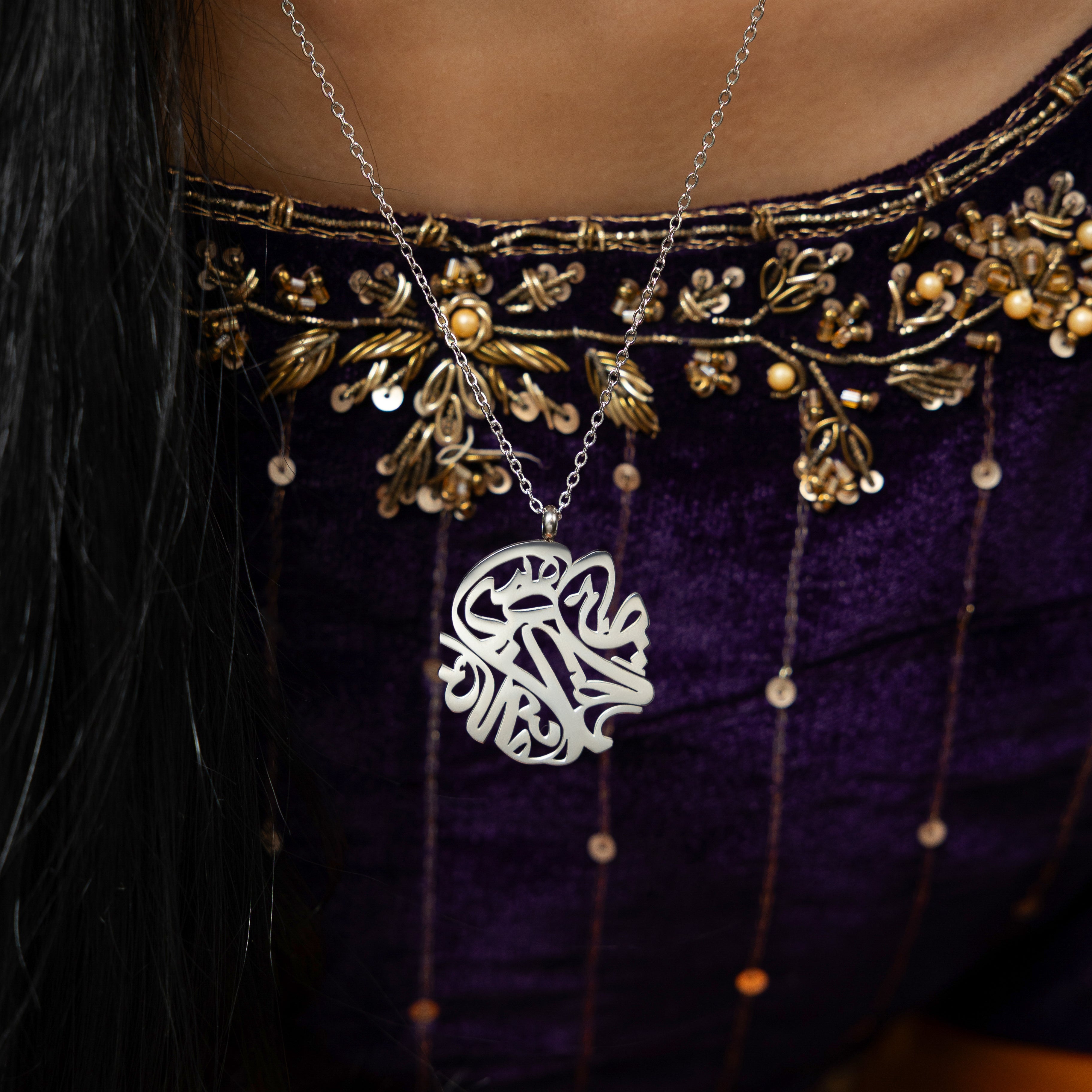 Model wearing the Elysian Relief Necklace, emphasizing its versatility for both casual and formal outfits.