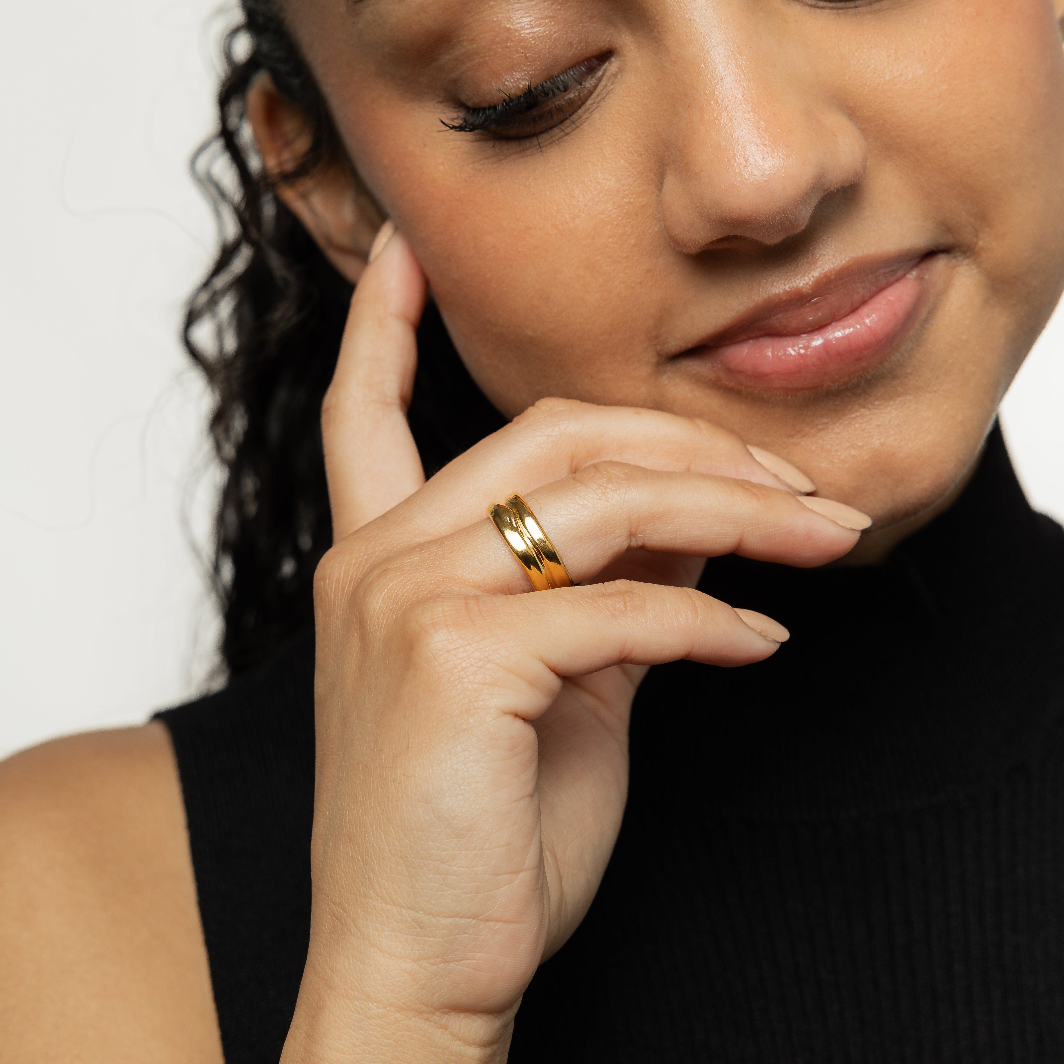Close-up of the Elegant Align Stackable Ring highlighting its gold finish and hypoallergenic features.