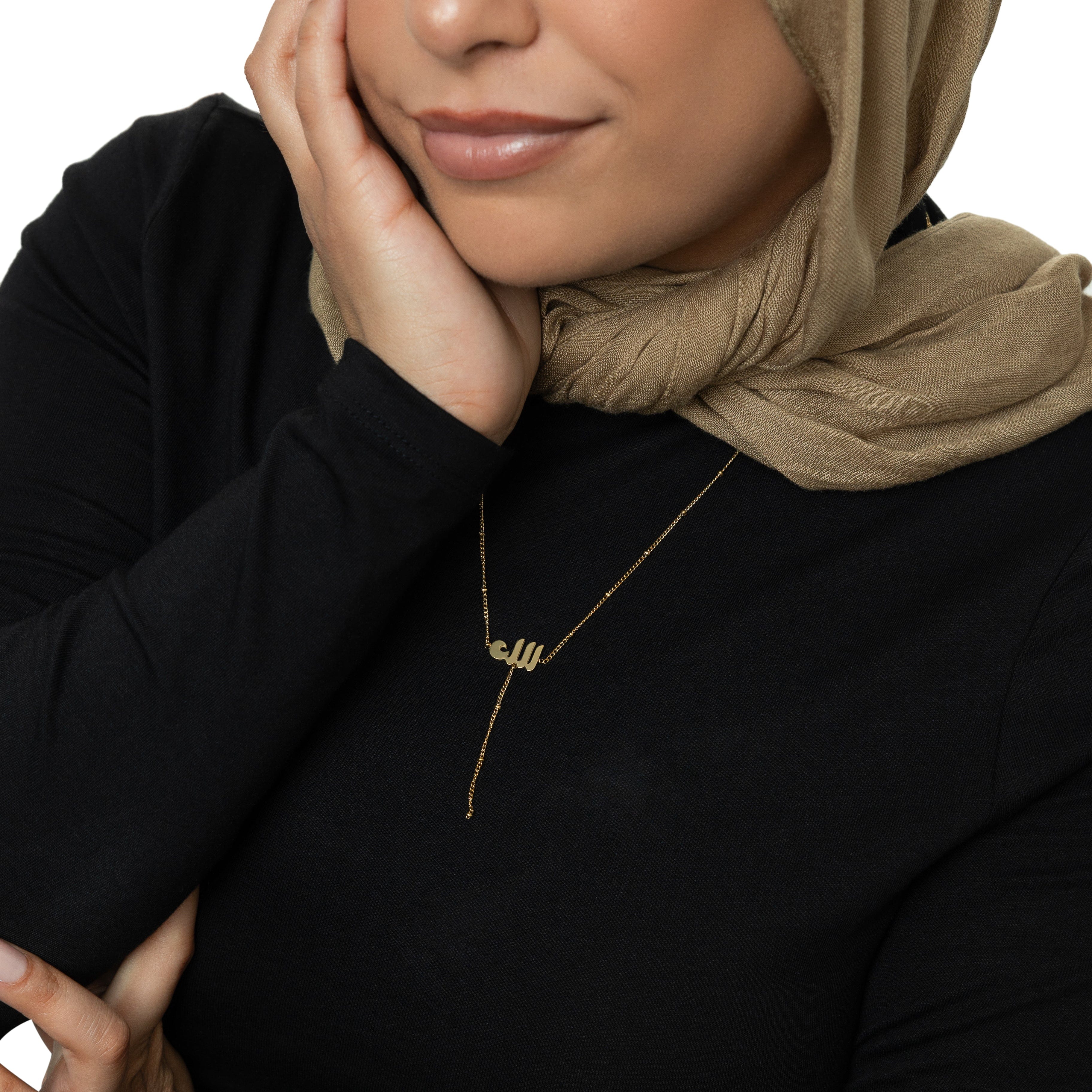 Close-up of the Allah pendant on a delicate dotted chain, highlighting its hypoallergenic design.