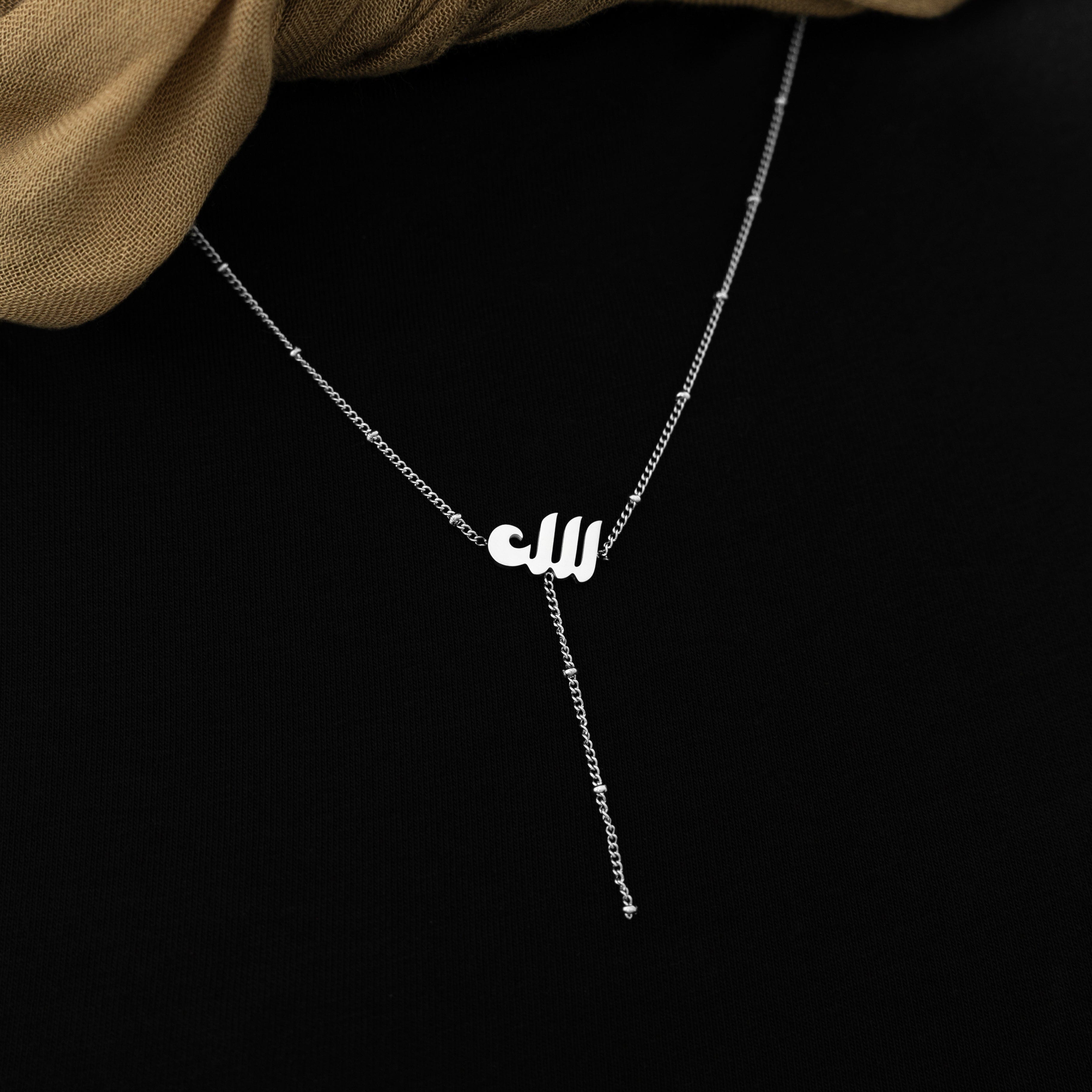 Close-up of the Allah pendant on a delicate dotted chain, highlighting its hypoallergenic design.