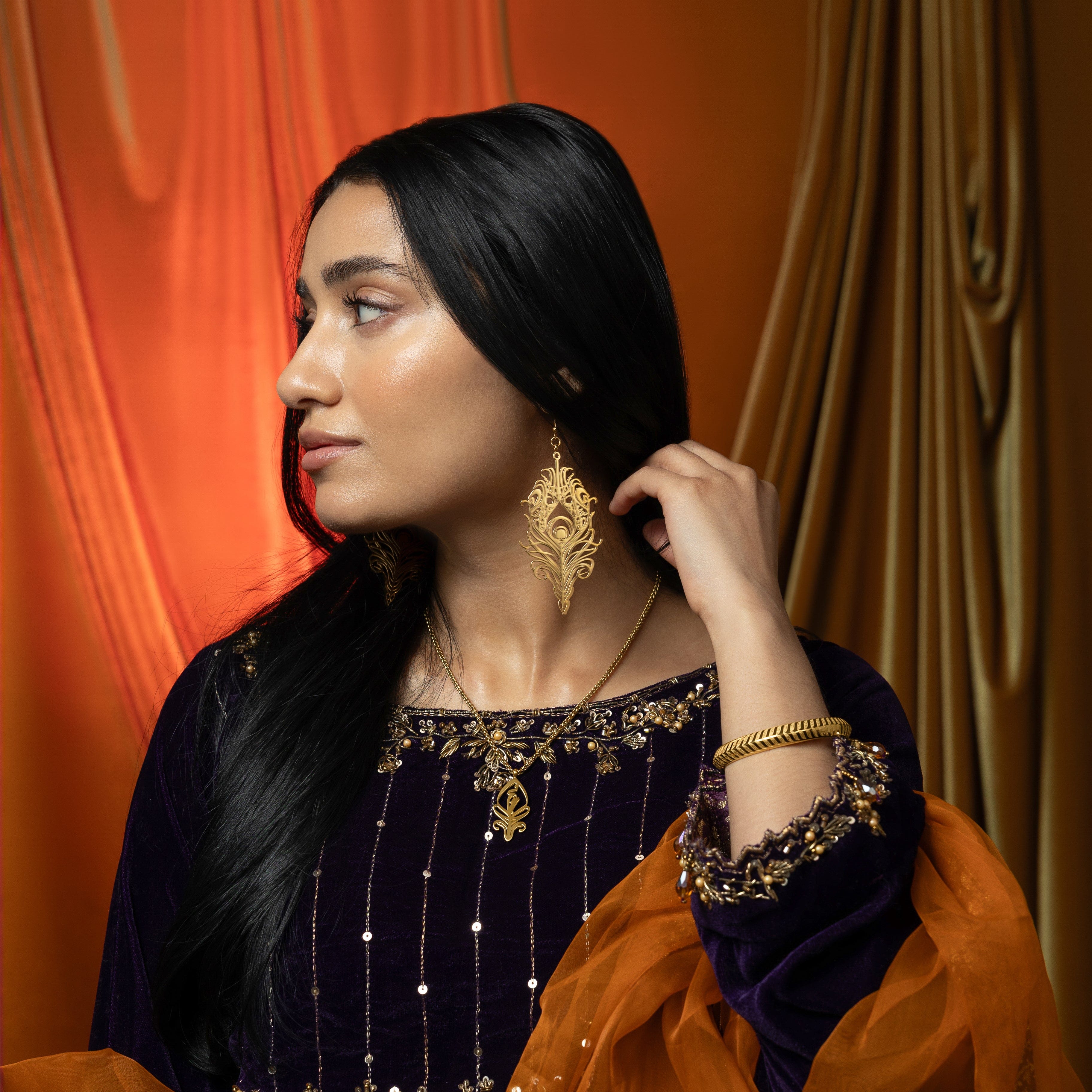 Close-up of the SALAAM Arabic calligraphy necklace showcasing its intricate design.