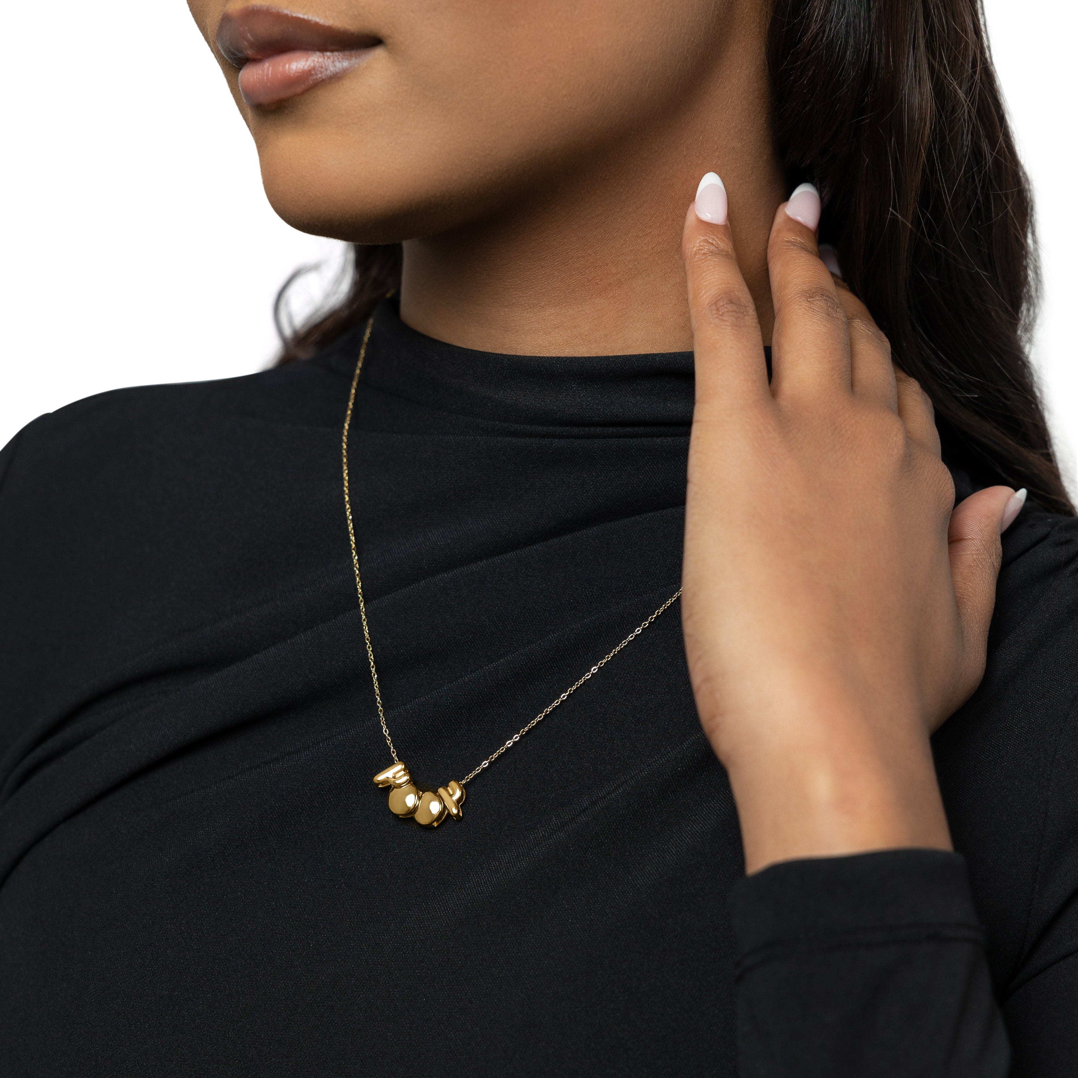 The birthyear charm necklace displayed in a velvet pouch, highlighting its luxurious packaging.