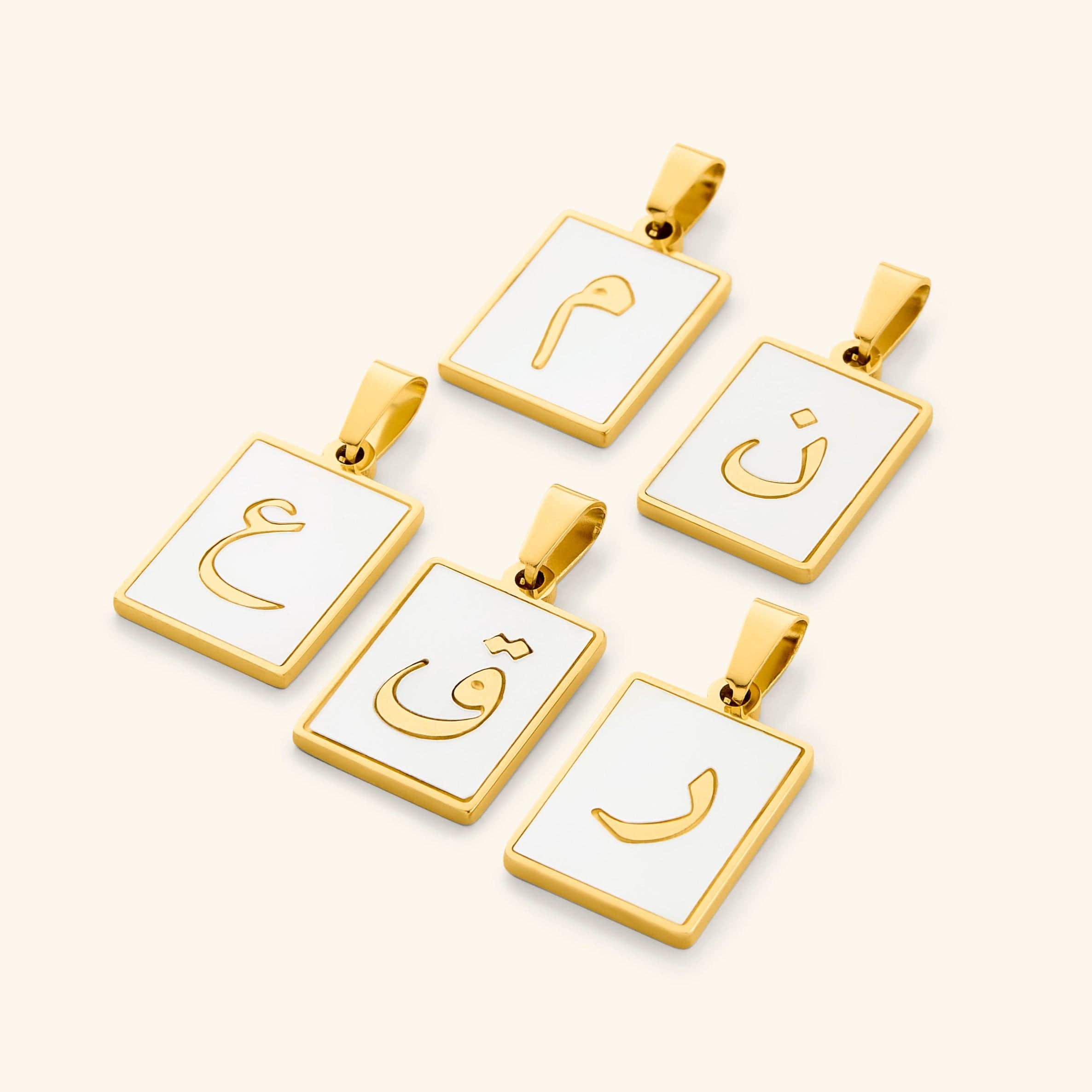 Close-up view of the Arabic letter charm attached to a beautiful Carabiner Necklace, highlighting its versatility.
