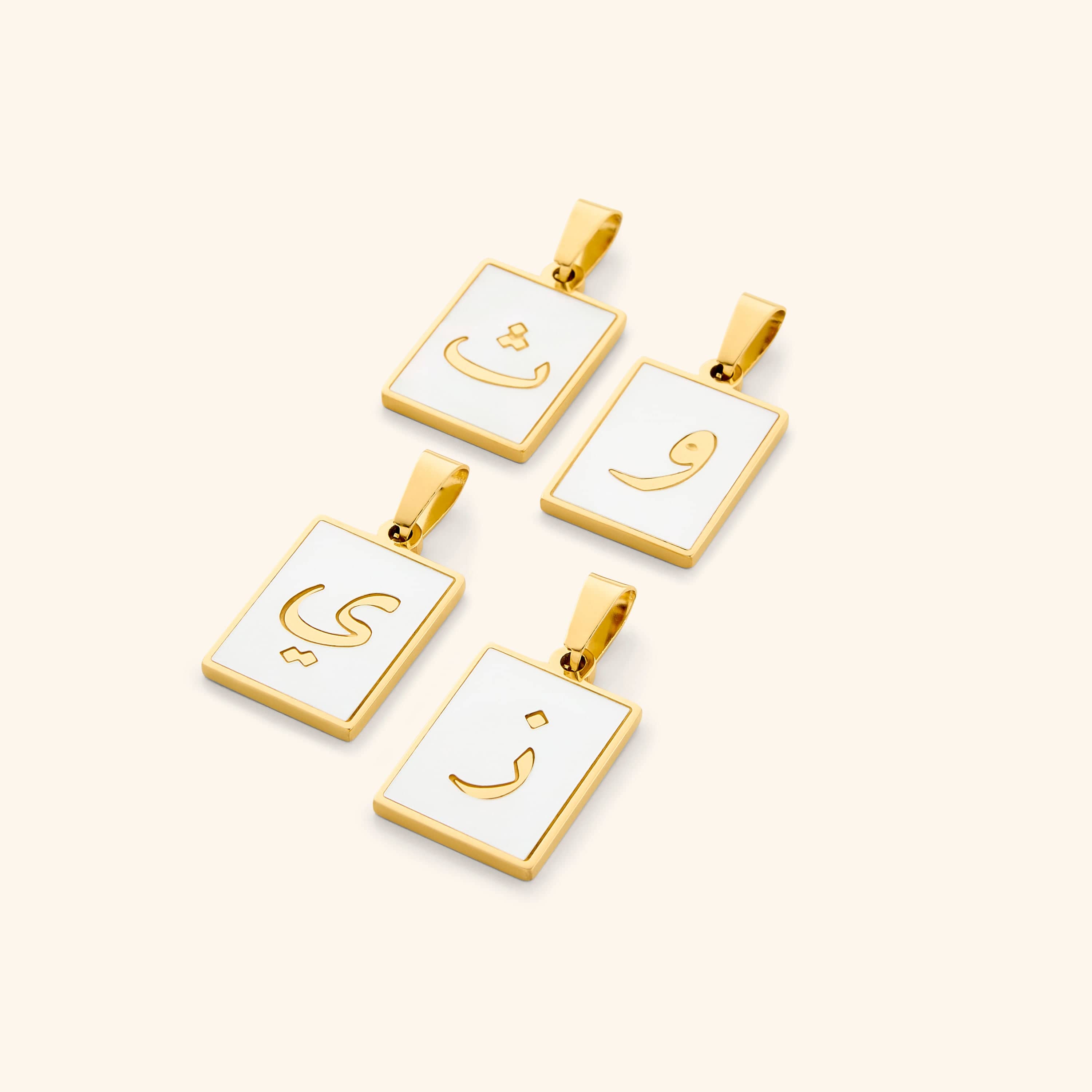 Close-up view of the Arabic letter charm attached to a beautiful Carabiner Necklace, highlighting its versatility.