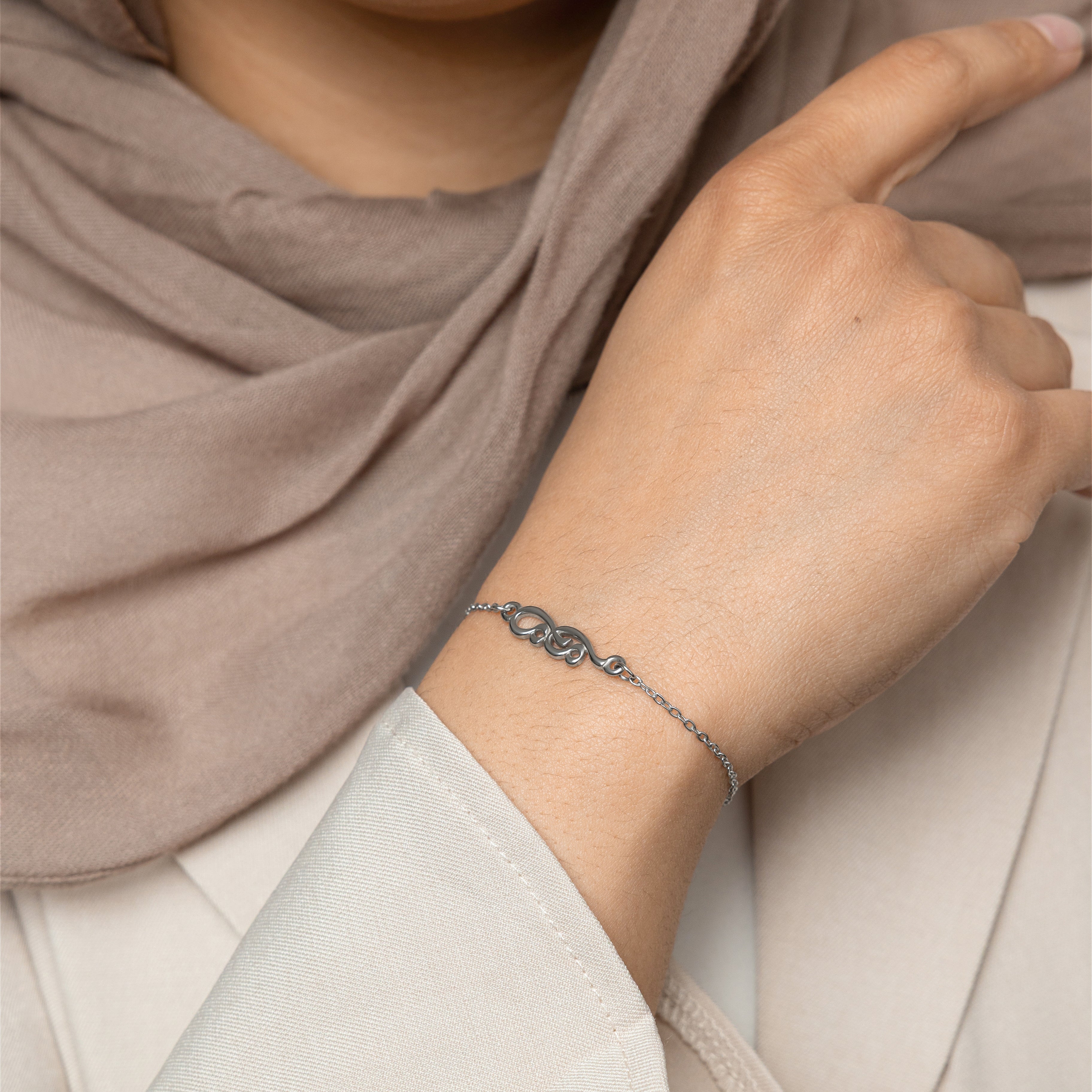 Elegant Arabic mama bracelet displayed in a velvet pouch