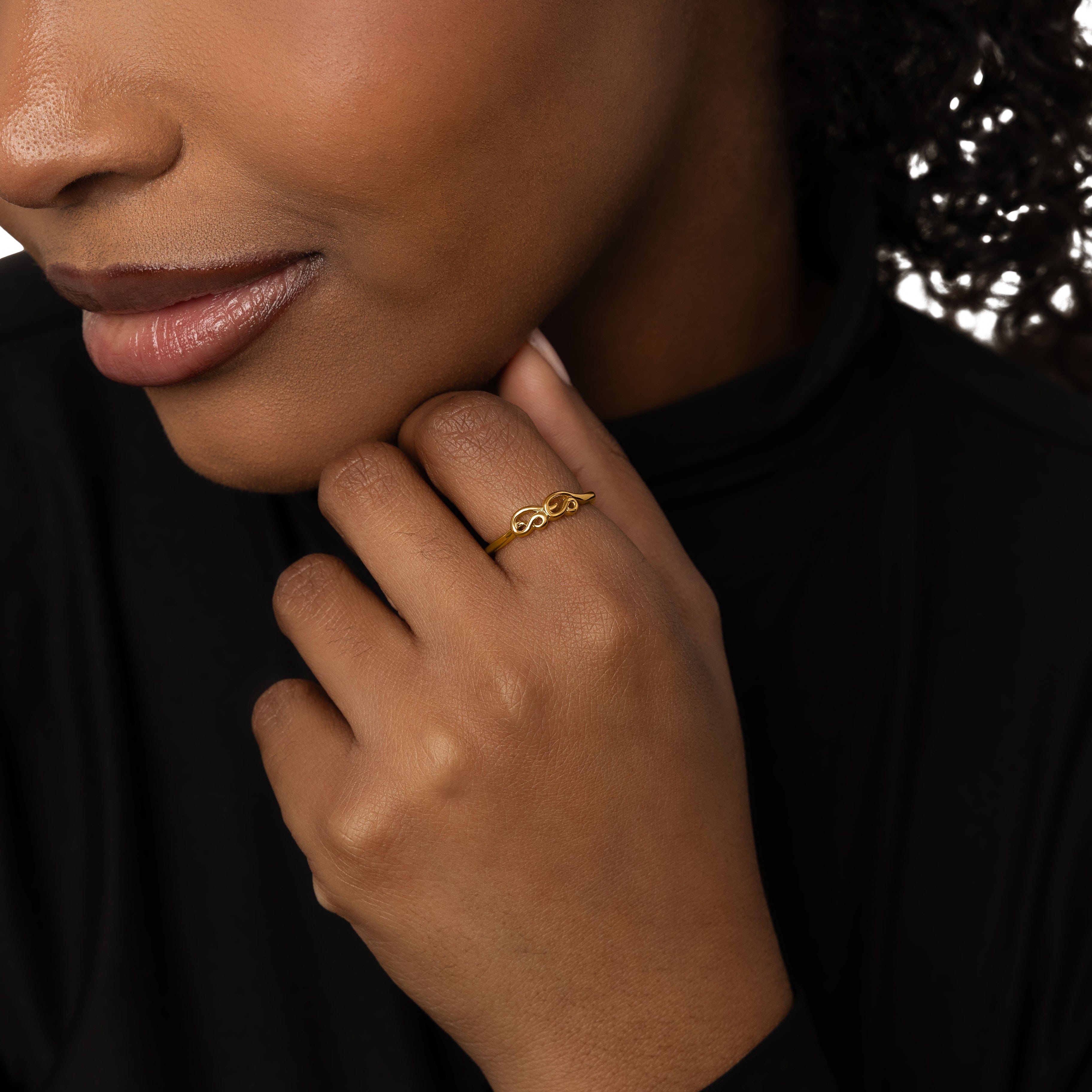 Elegant Arabic Mama Ring showcasing intricate design and shine.