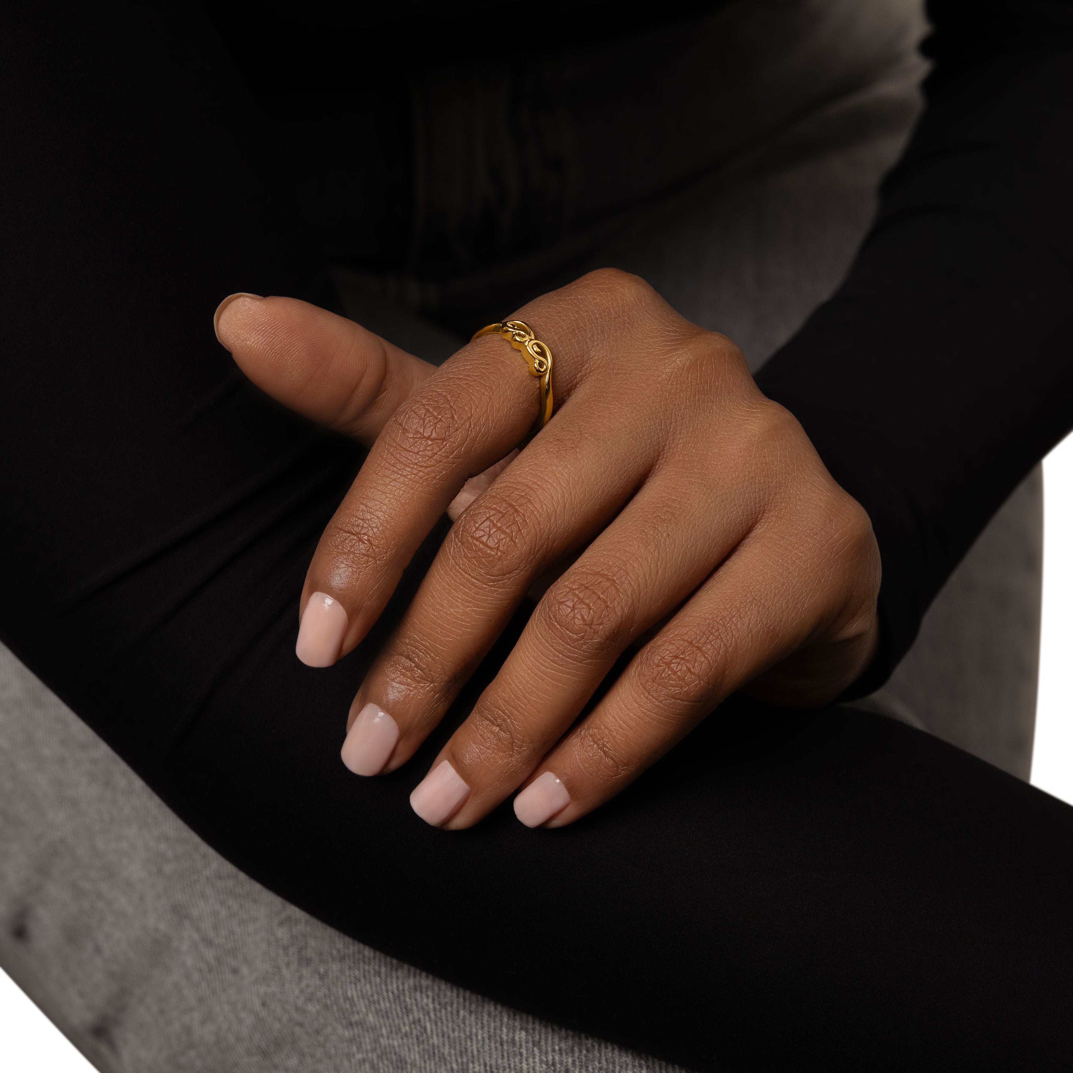 Close-up of the mama ring emphasizing the gold plating and craftsmanship.