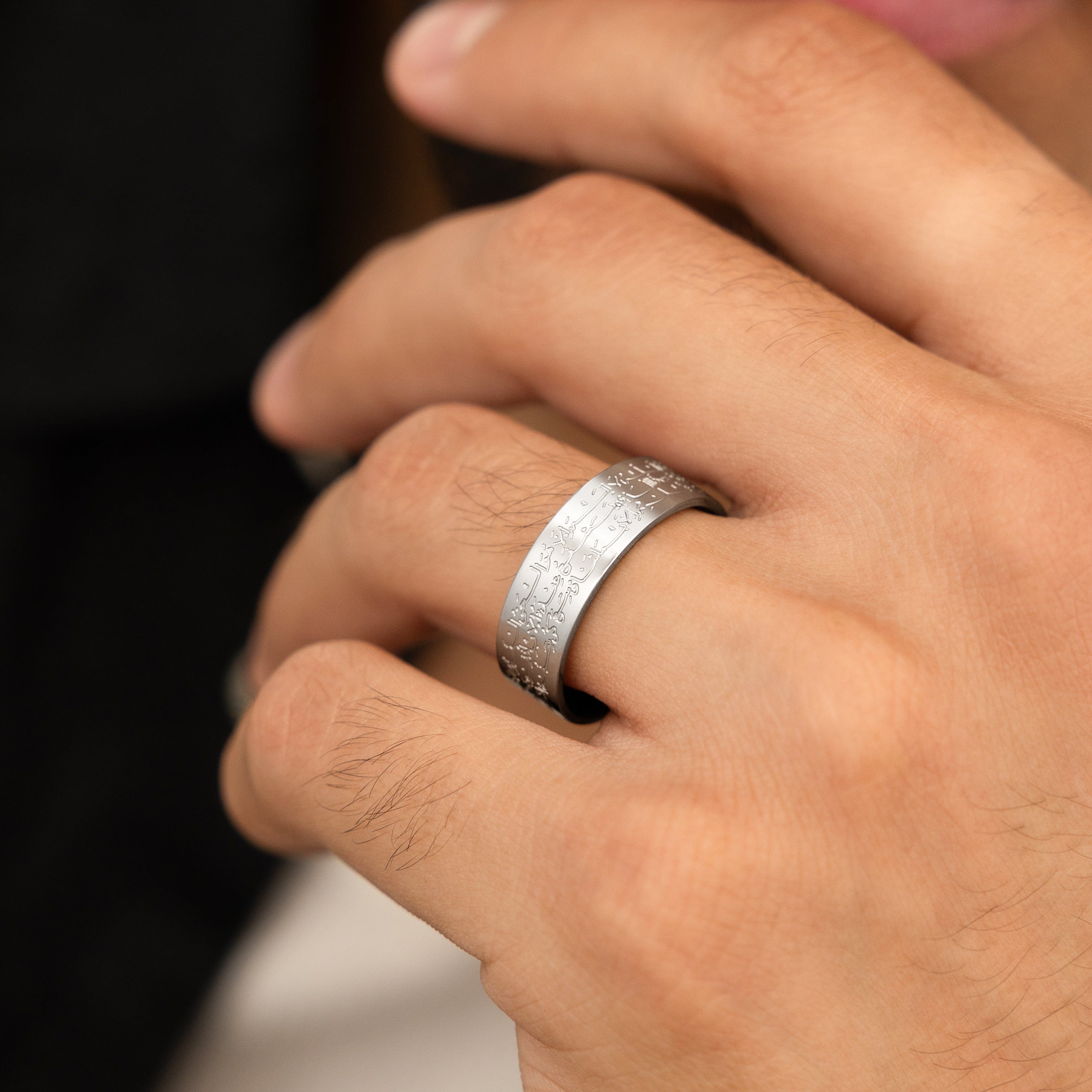 Ayatul Kursi ring worn by a man, symbolizing faith and elegance.