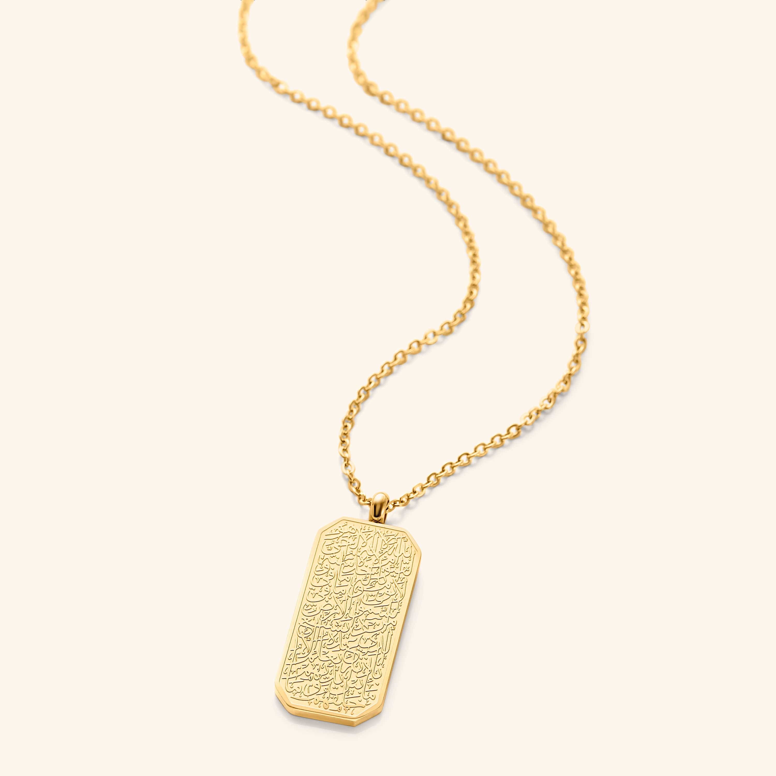 Close-up of the Ayatul Kursi gold necklace showcasing its intricate engraving and shine.