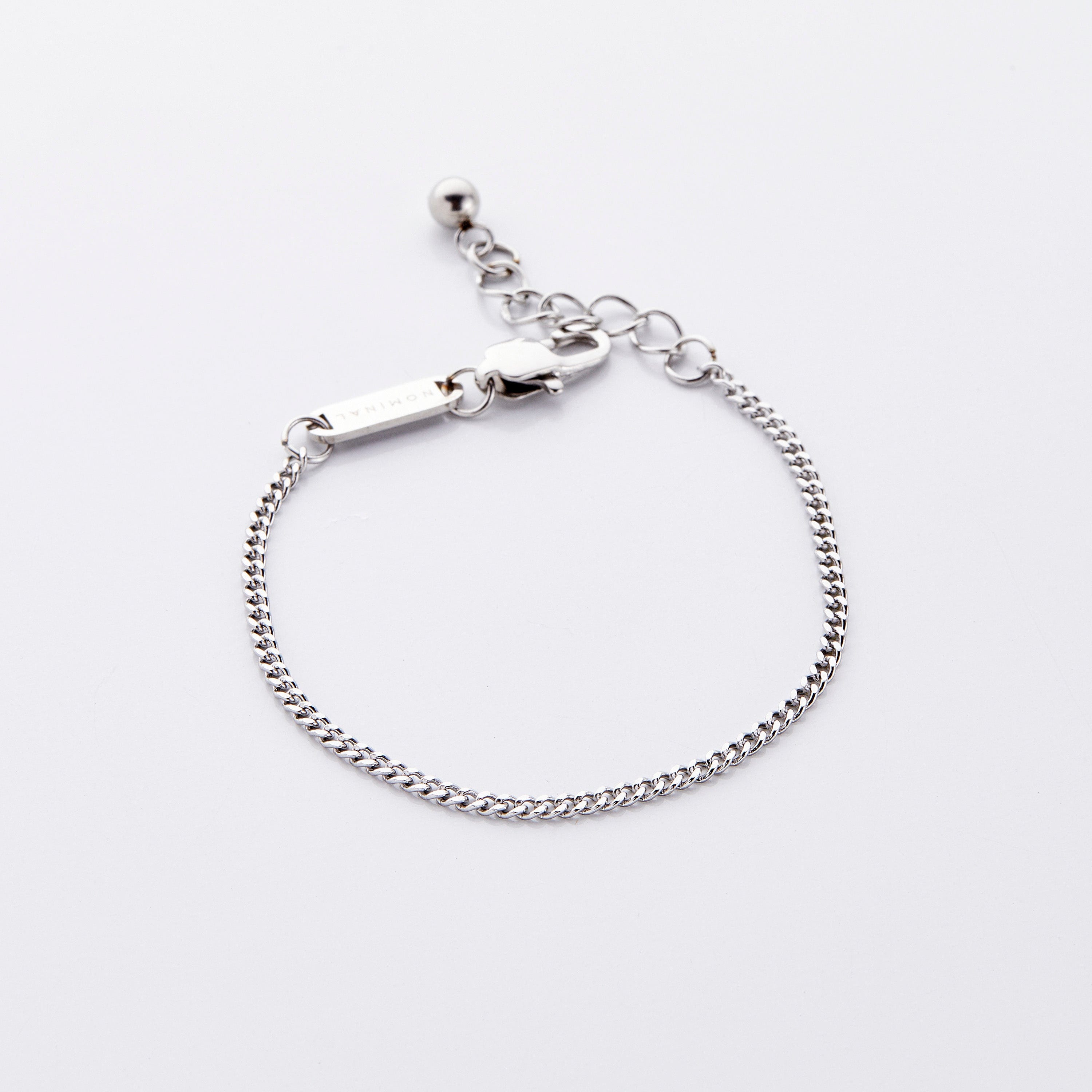 Stylish stainless steel Cuban chain bracelet for boys, showcasing its uniform links and shine.