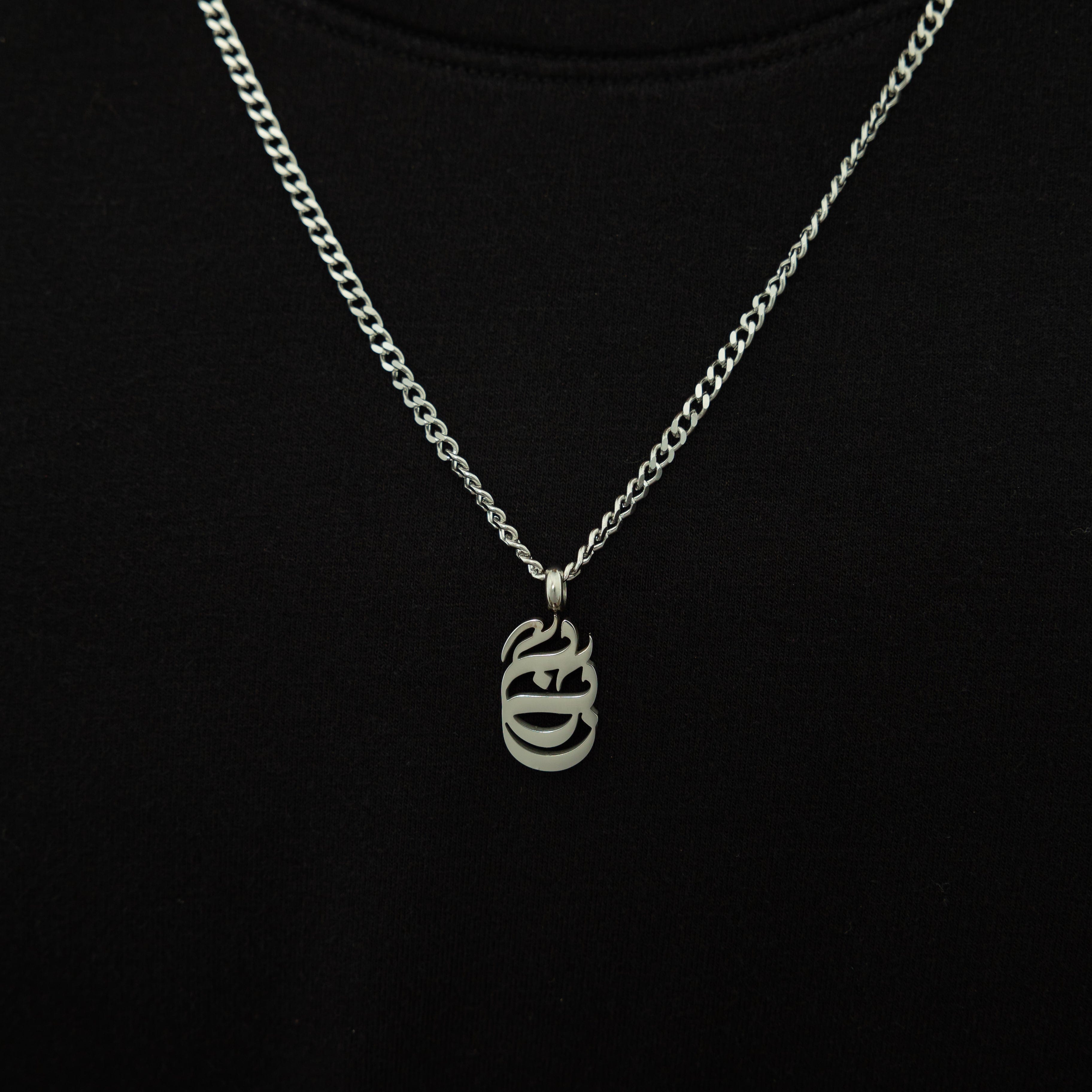 Baba Oval Necklace worn by a man in casual attire