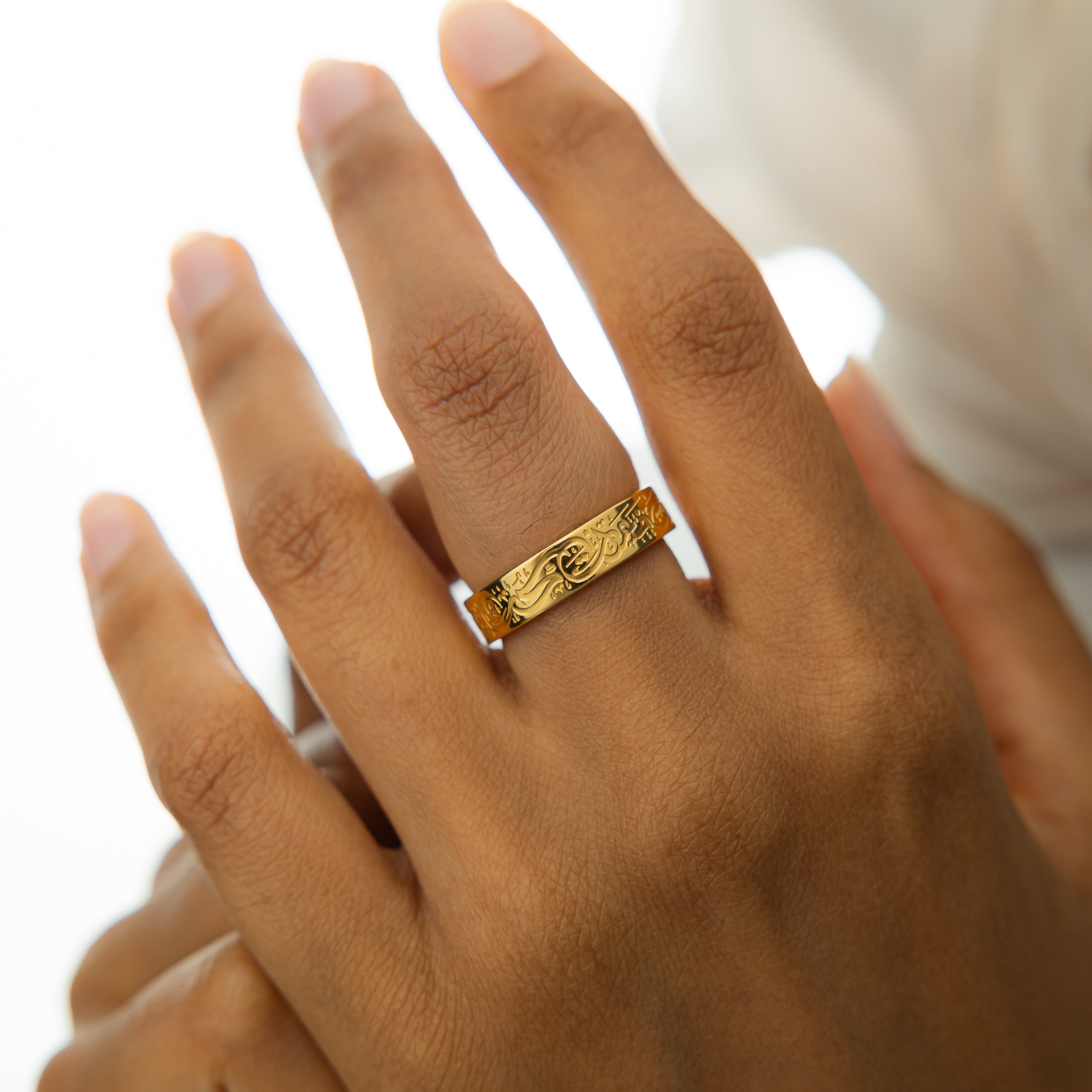 Rumi ring displayed in its velvet pouch, highlighting its beautiful packaging.