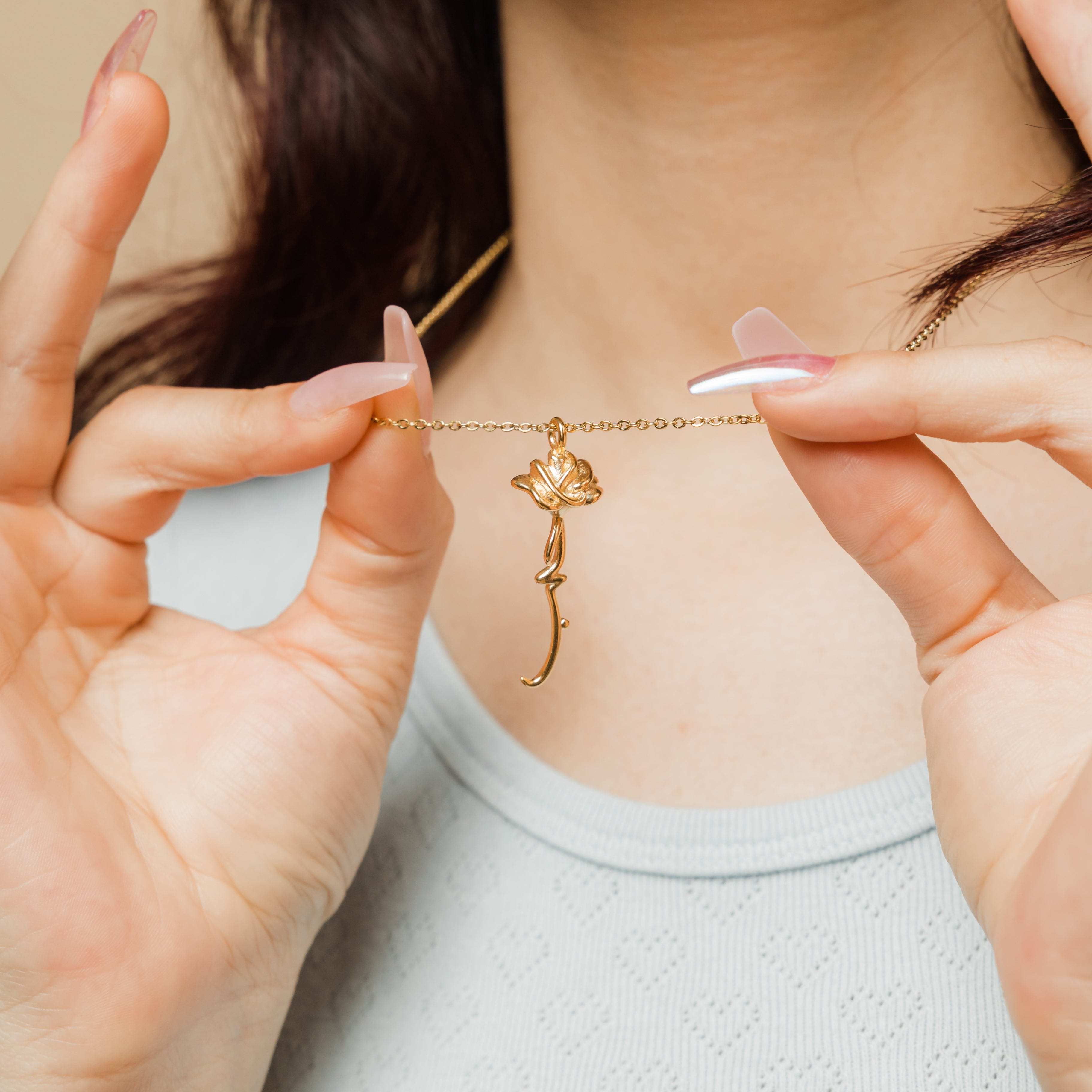 Model wearing the Eternal Love Rose Pendant Necklace at a length of 22 inches, highlighting its versatility.