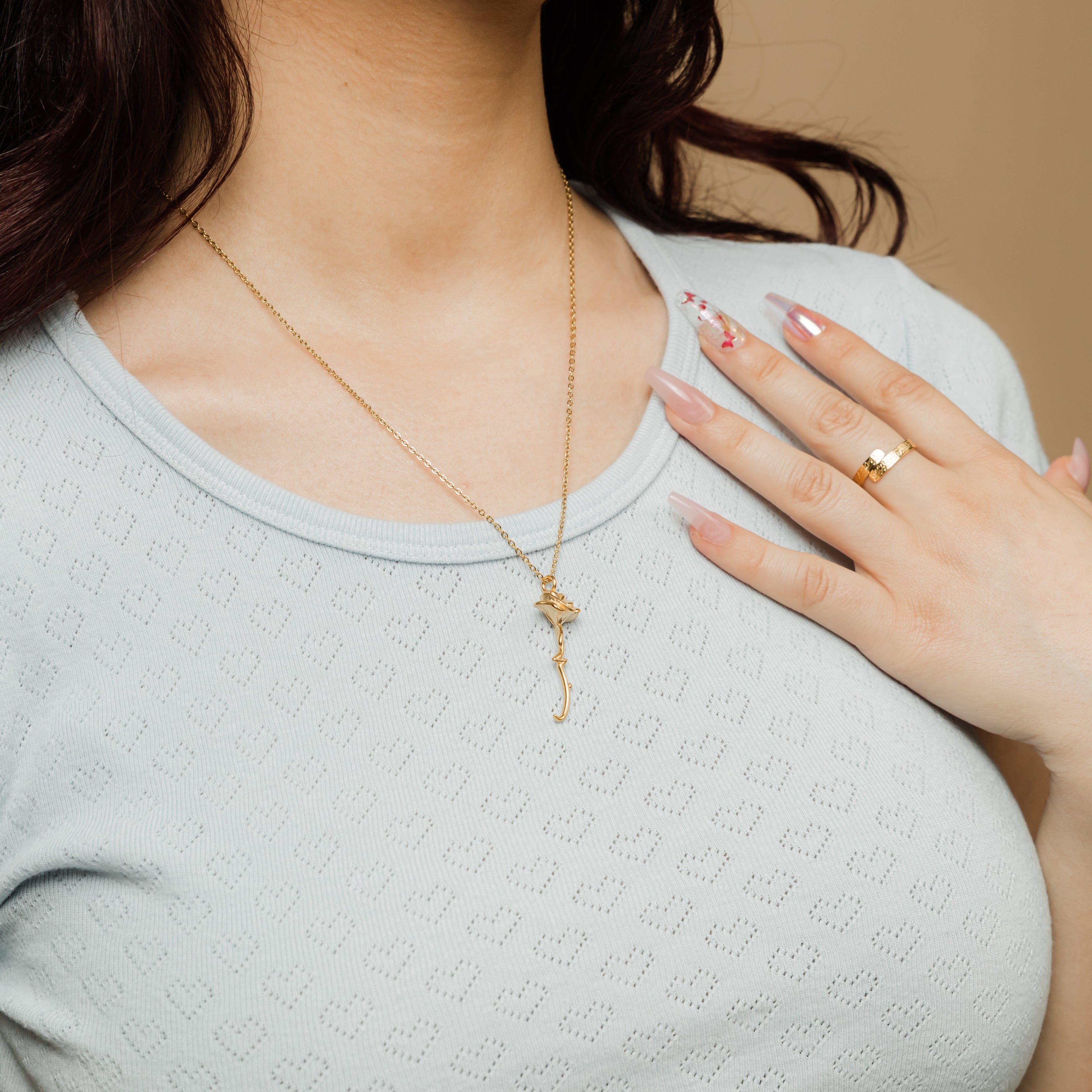 Model wearing the Eternal Love Rose Pendant Necklace at a length of 22 inches, highlighting its versatility.