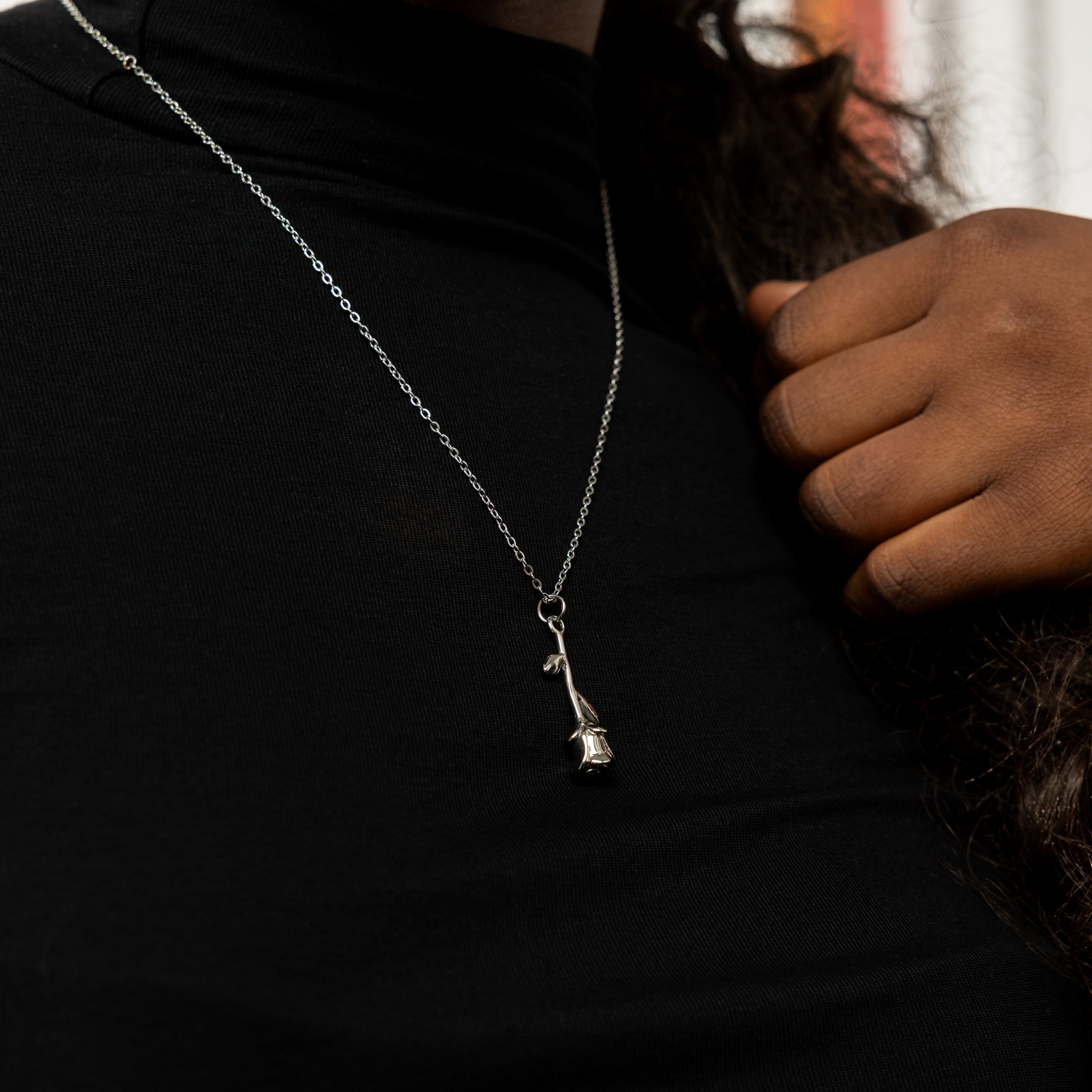 Blooming Elegance Gold Necklace in its velvet pouch, perfect for gifting.