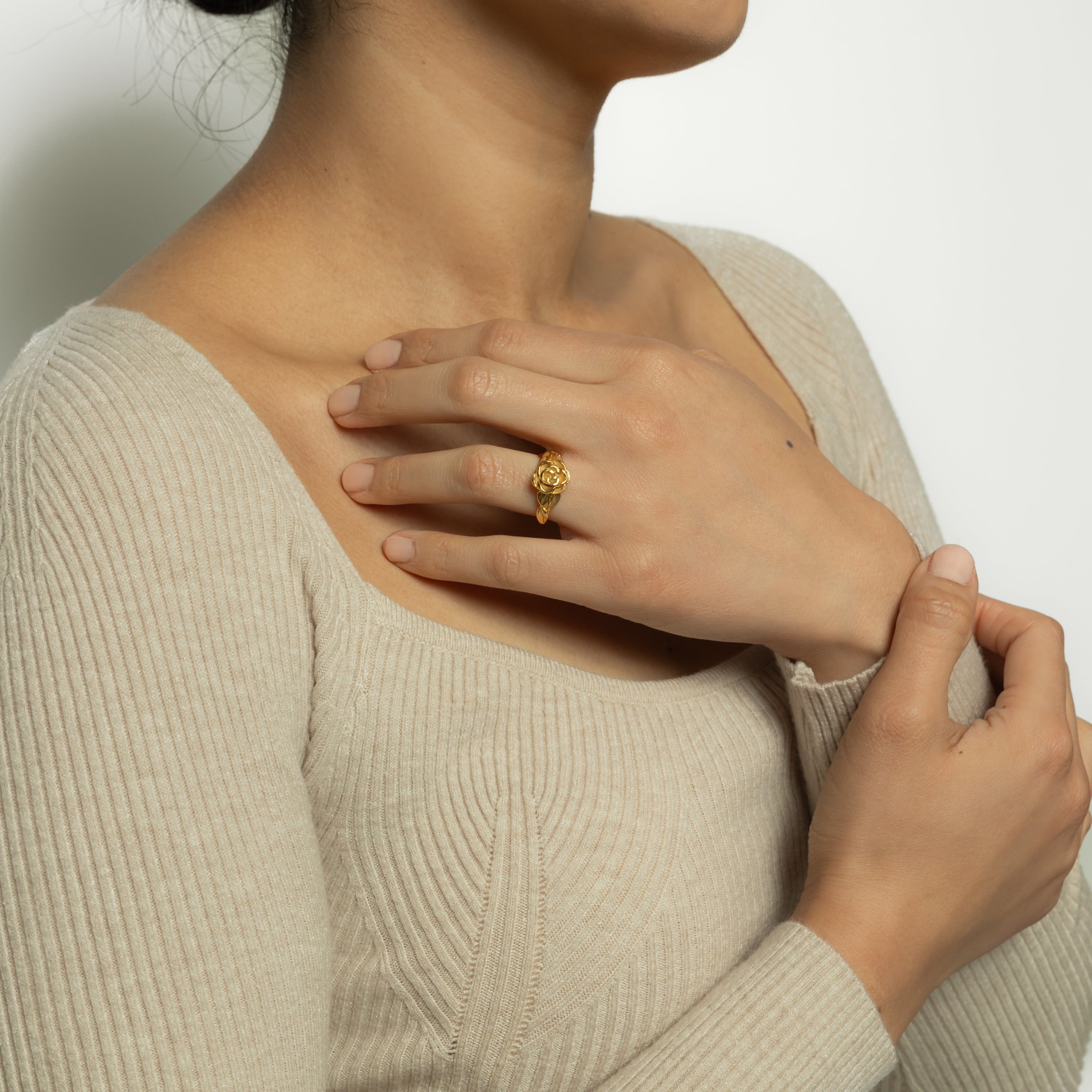 Close-up of the Eternal Bloom Hypoallergenic Ring highlighting its intricate rose design and gold finish.