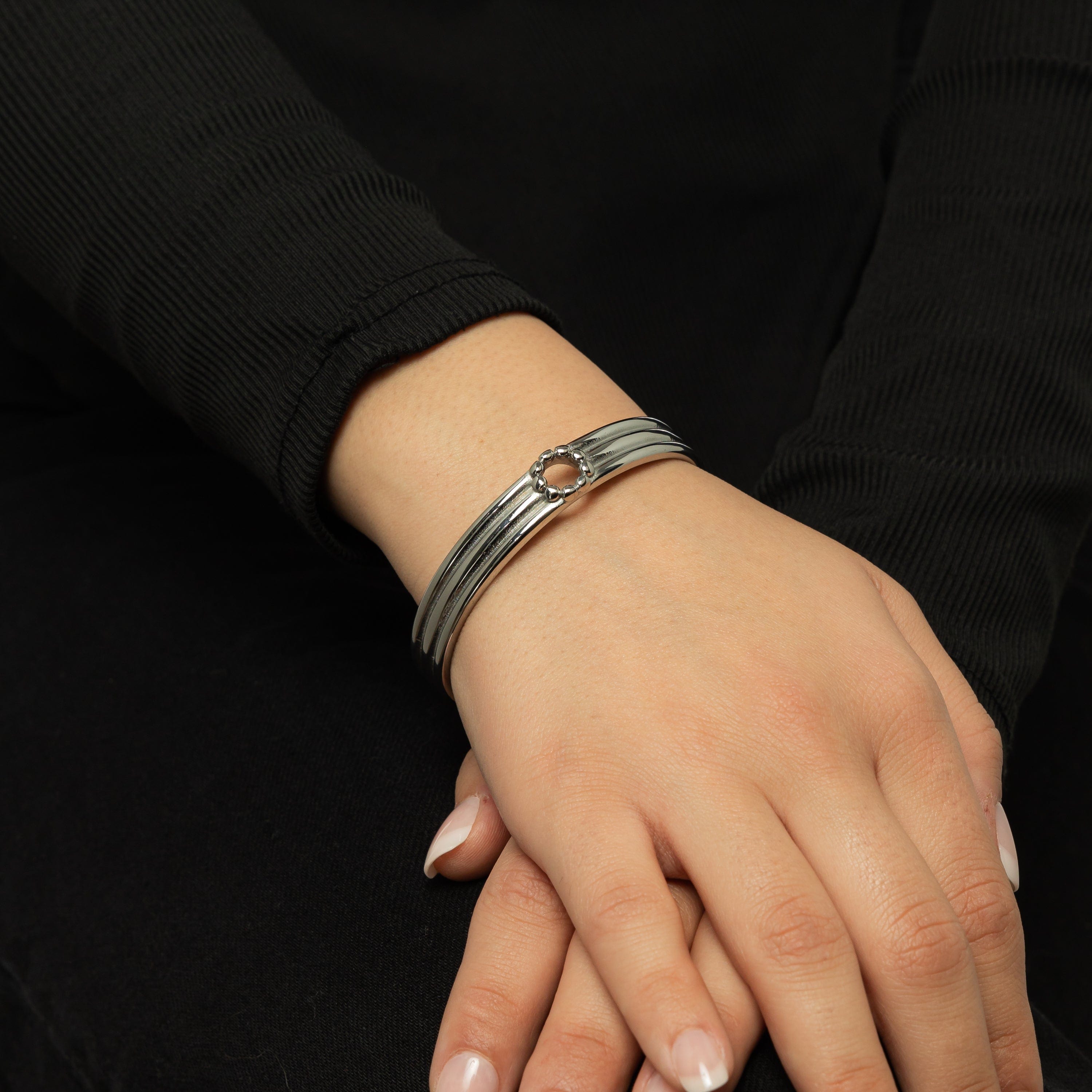 Close-up of the gold-plated Eternal Blossom Bangle highlighting its craftsmanship