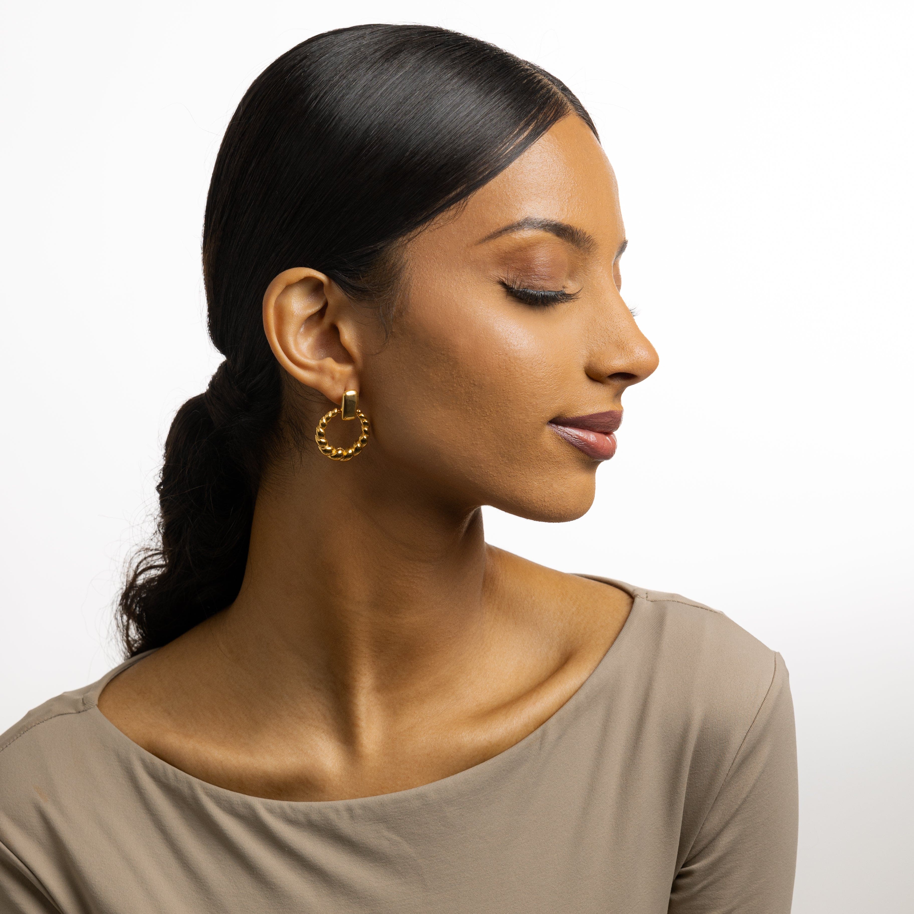 Chic braided statement hoops showcasing luxury design and waterproof feature.