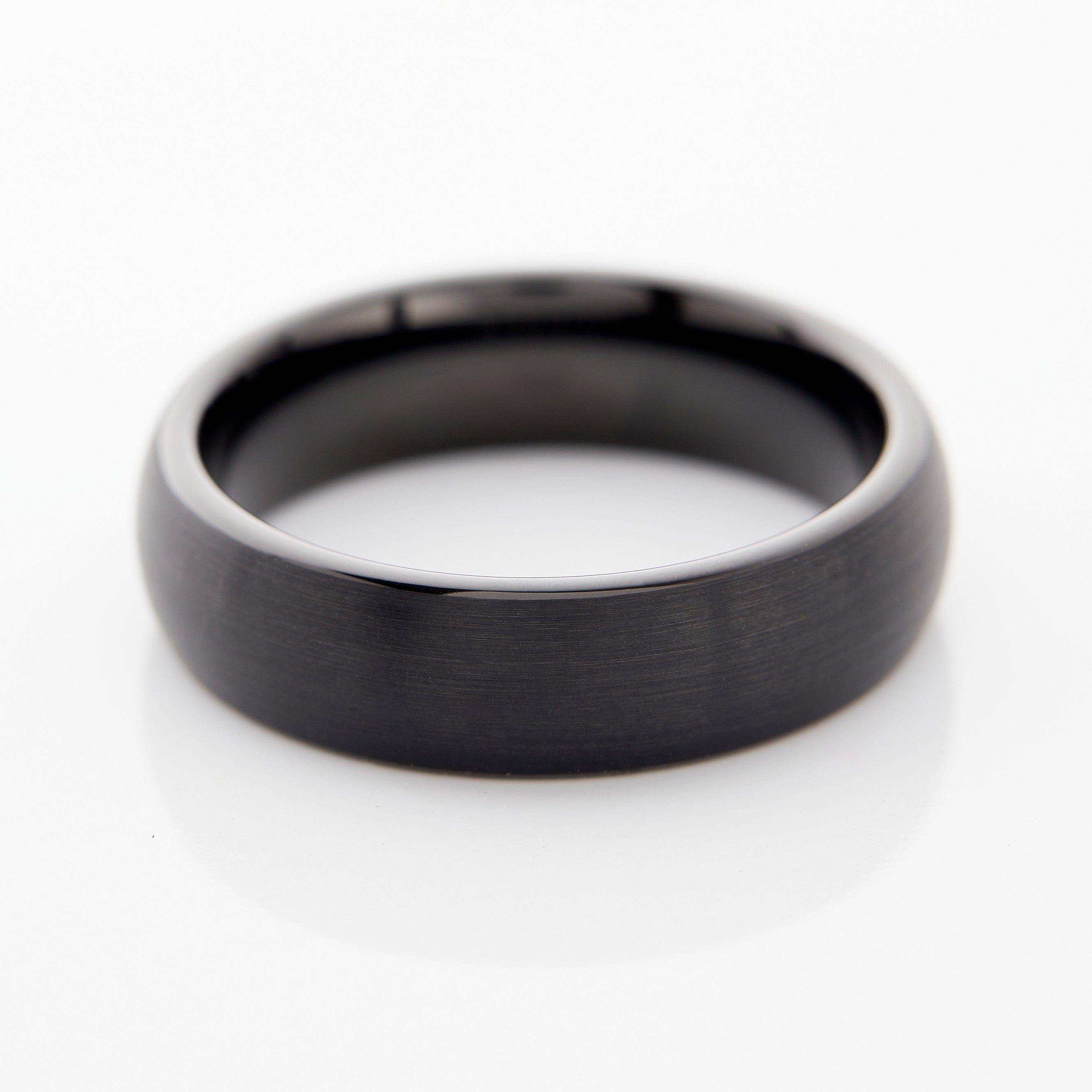 Black brushed tungsten wedding band displayed in a gift box, perfect for weddings.