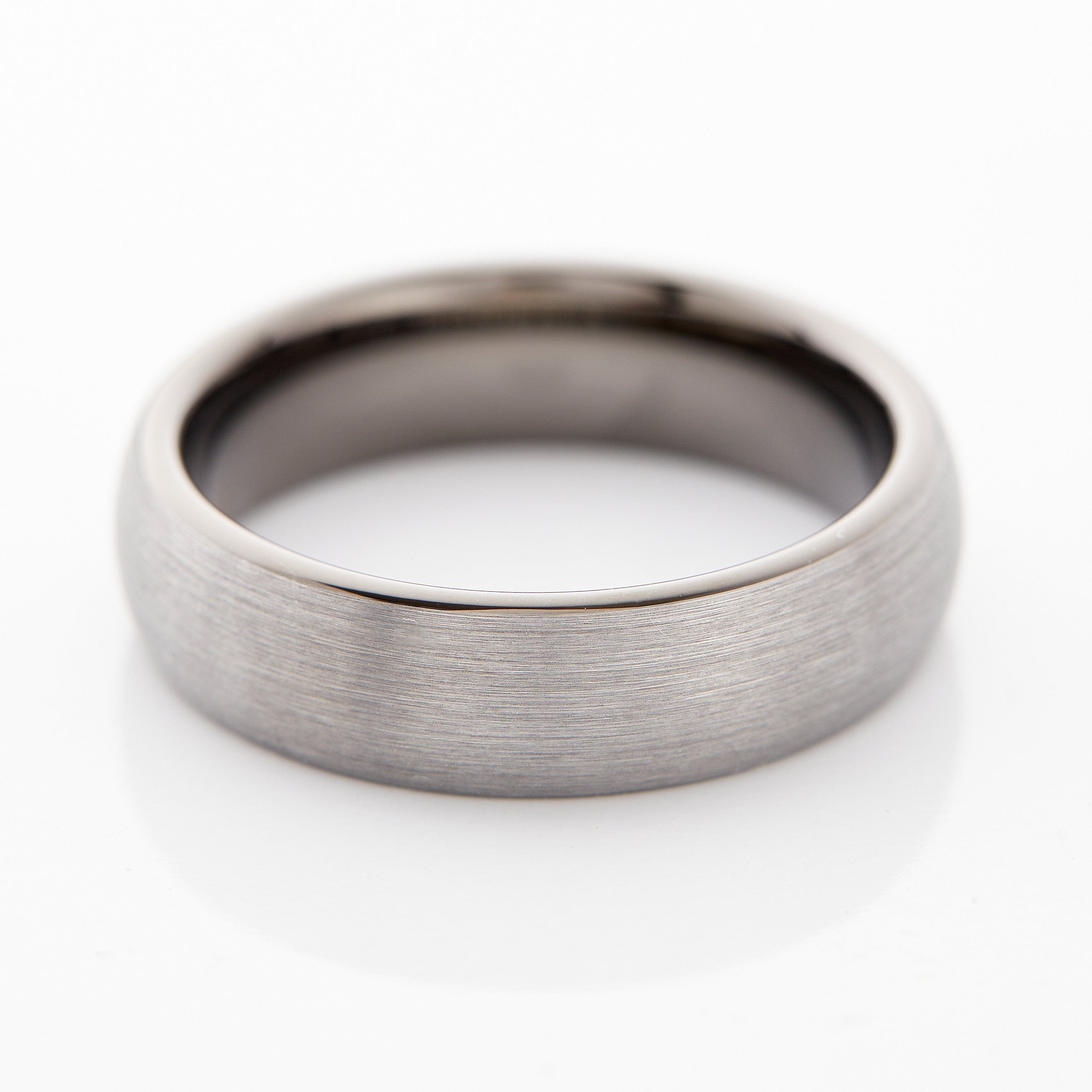 Brushed tungsten wedding band in silver, showcasing its elegant finish from a side angle.