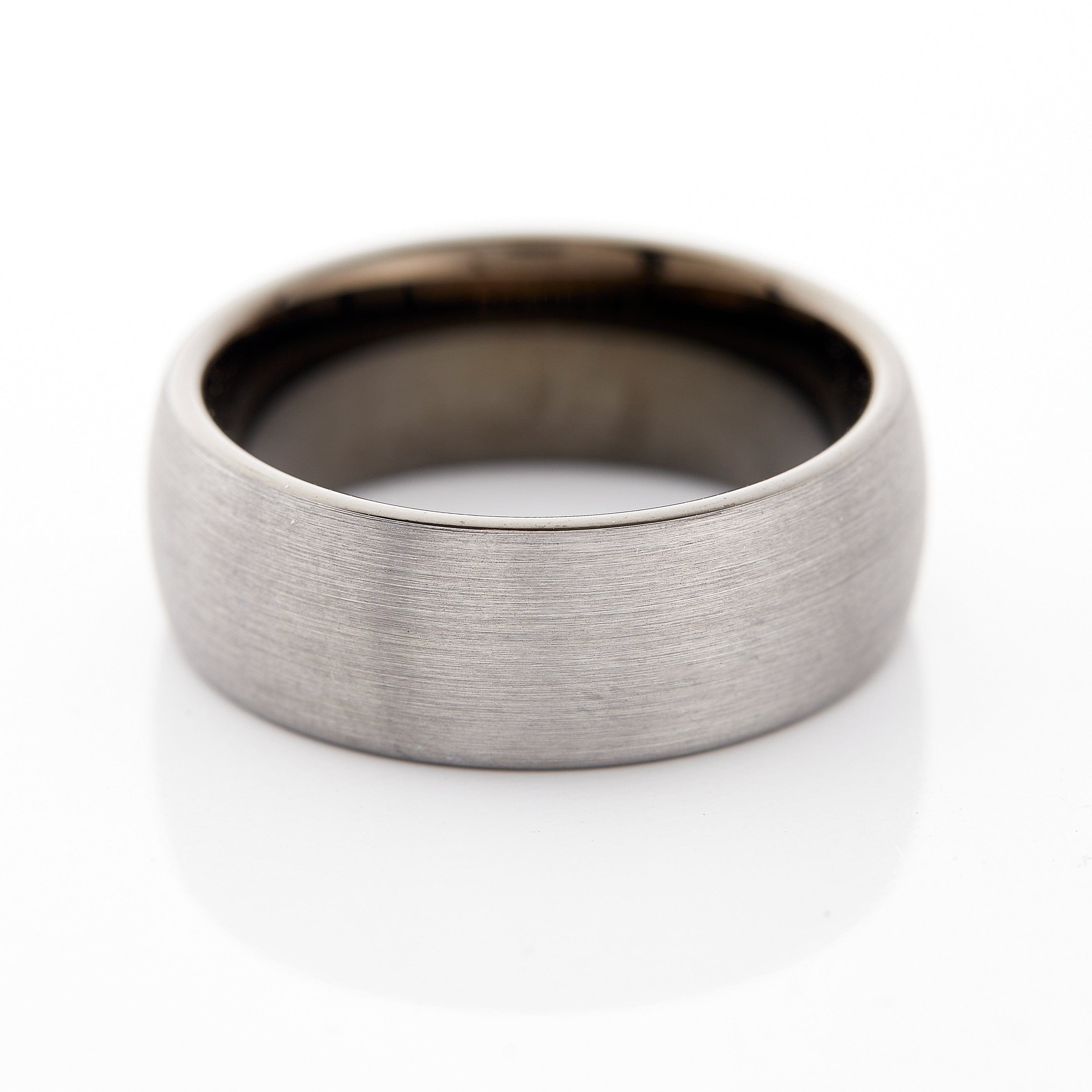 Black brushed tungsten wedding band displayed in a gift box, perfect for weddings.