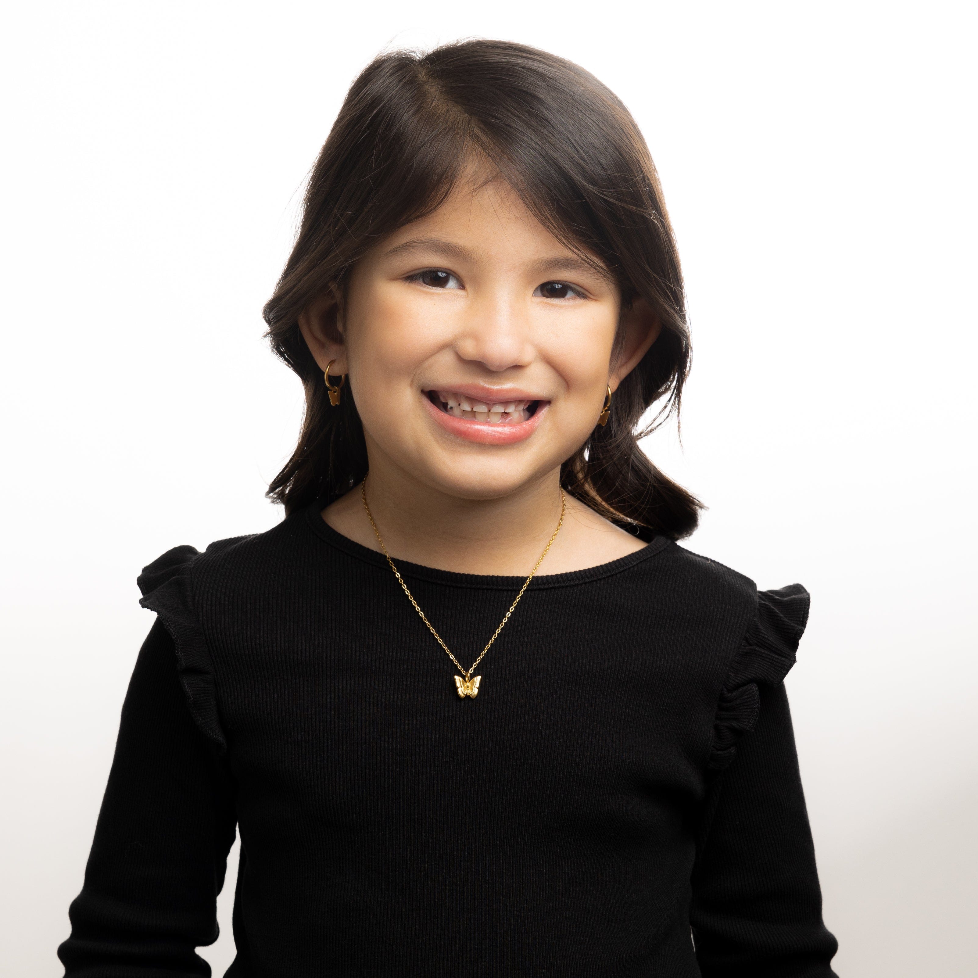 Close-up of the enchanting butterfly necklace for girls, showcasing its intricate design.