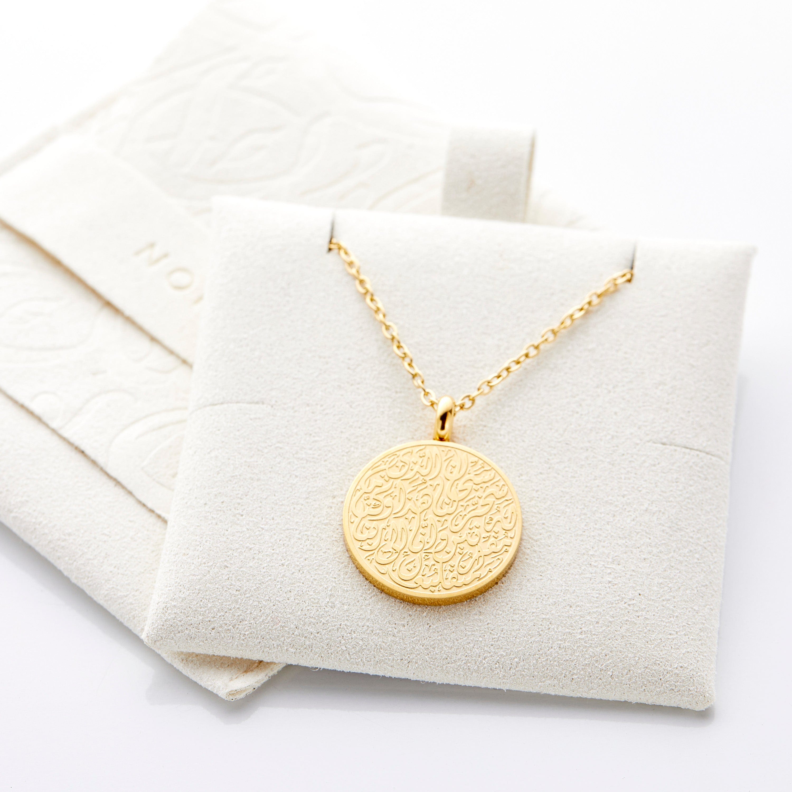 Travel prayer car hanger in its velvet pouch, highlighting its elegant presentation as a religious gift.