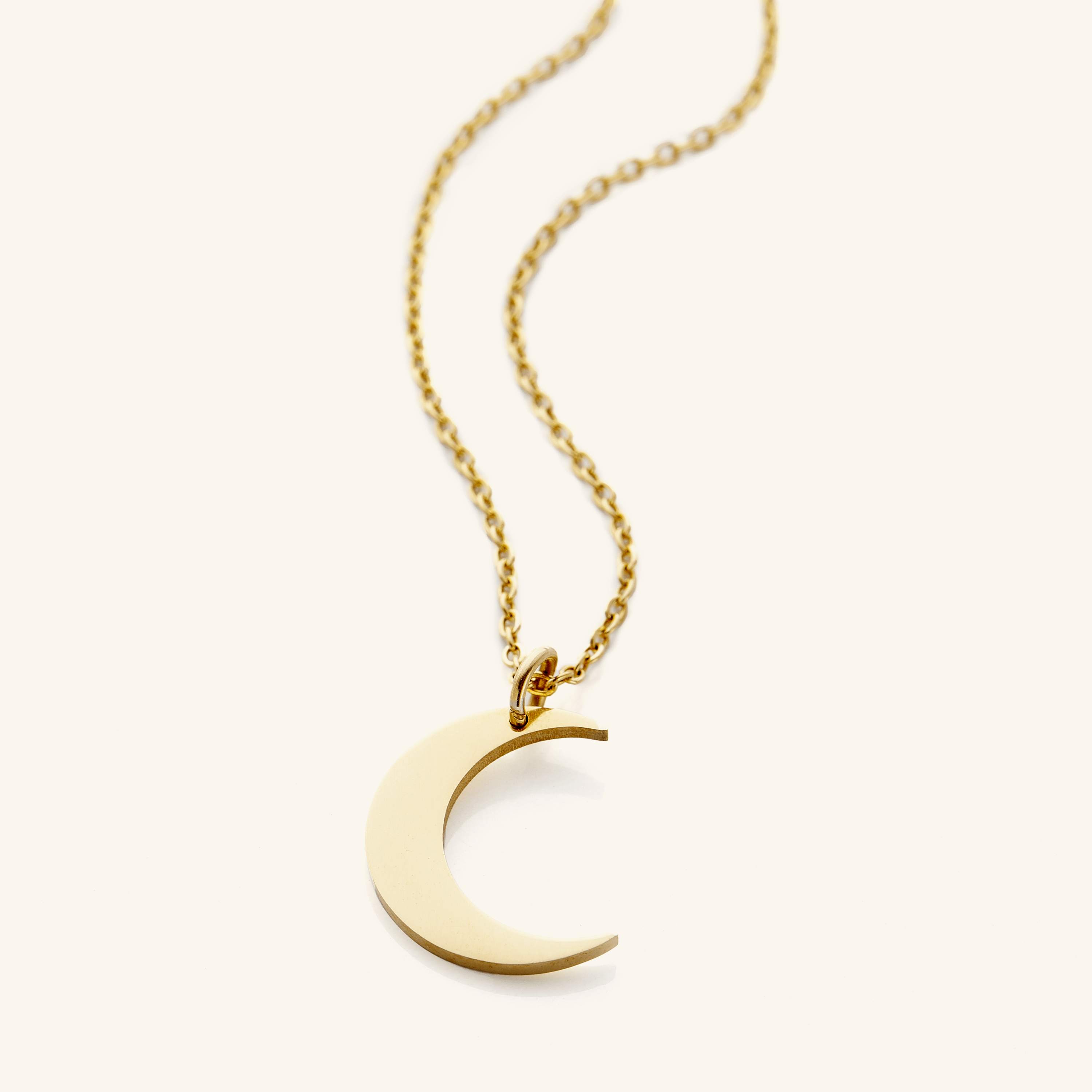 Celestial Elegance Crescent Necklace displayed elegantly on a white background