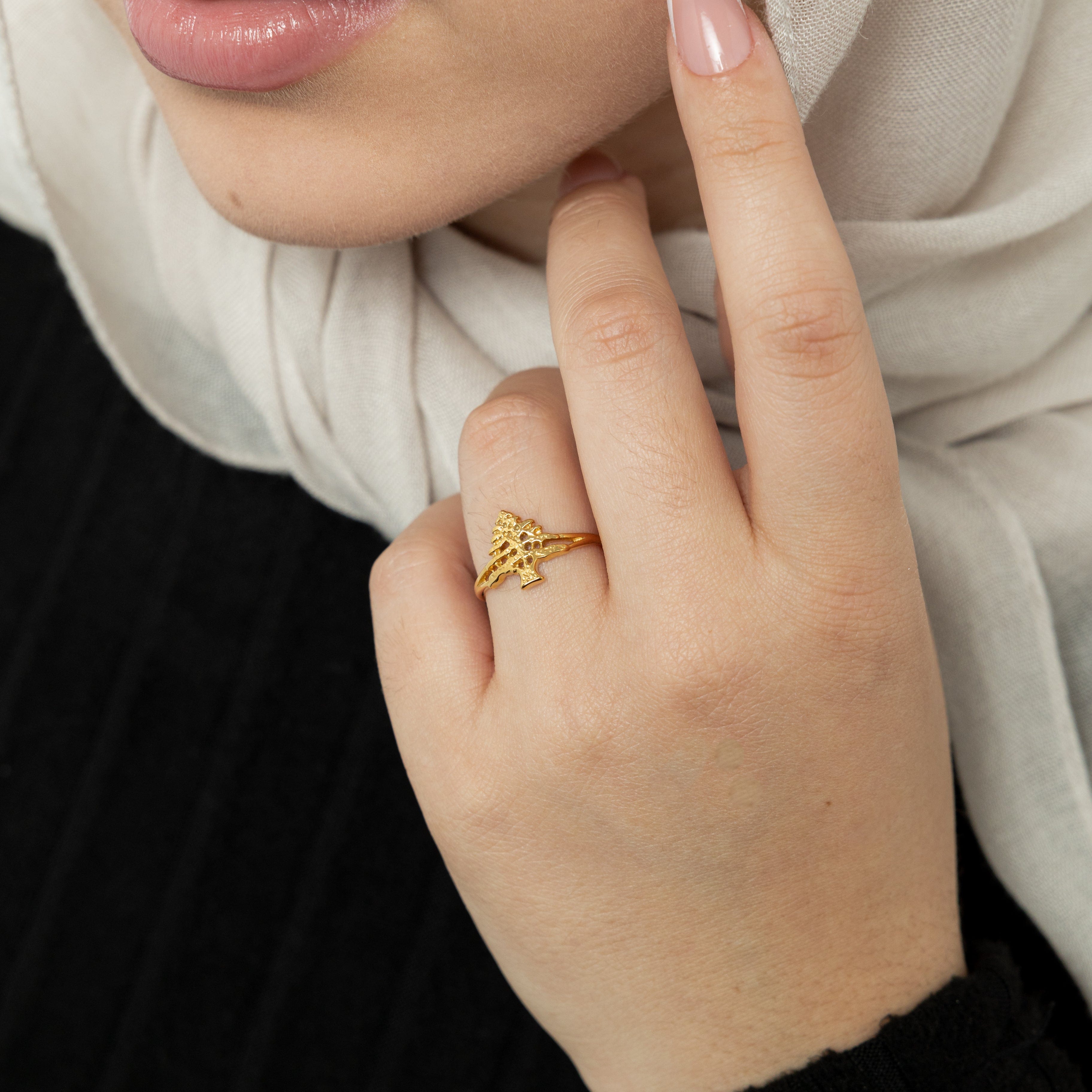 Close-up of the Cedar ring highlighting its beautiful gold plating and sleek design, perfect for sensitive skin.