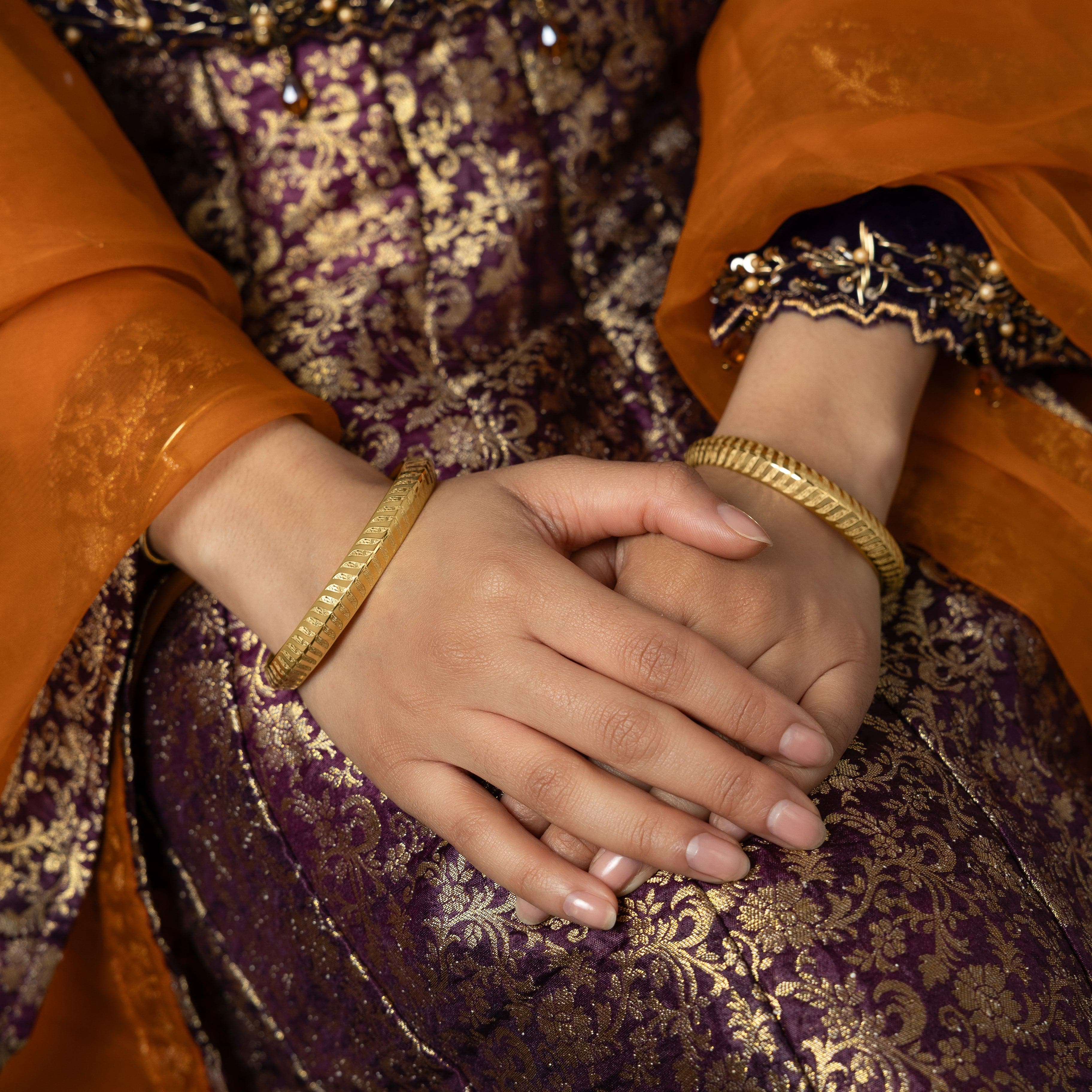 Close-up of the intricate design on the Kun Faya Kun Bangle