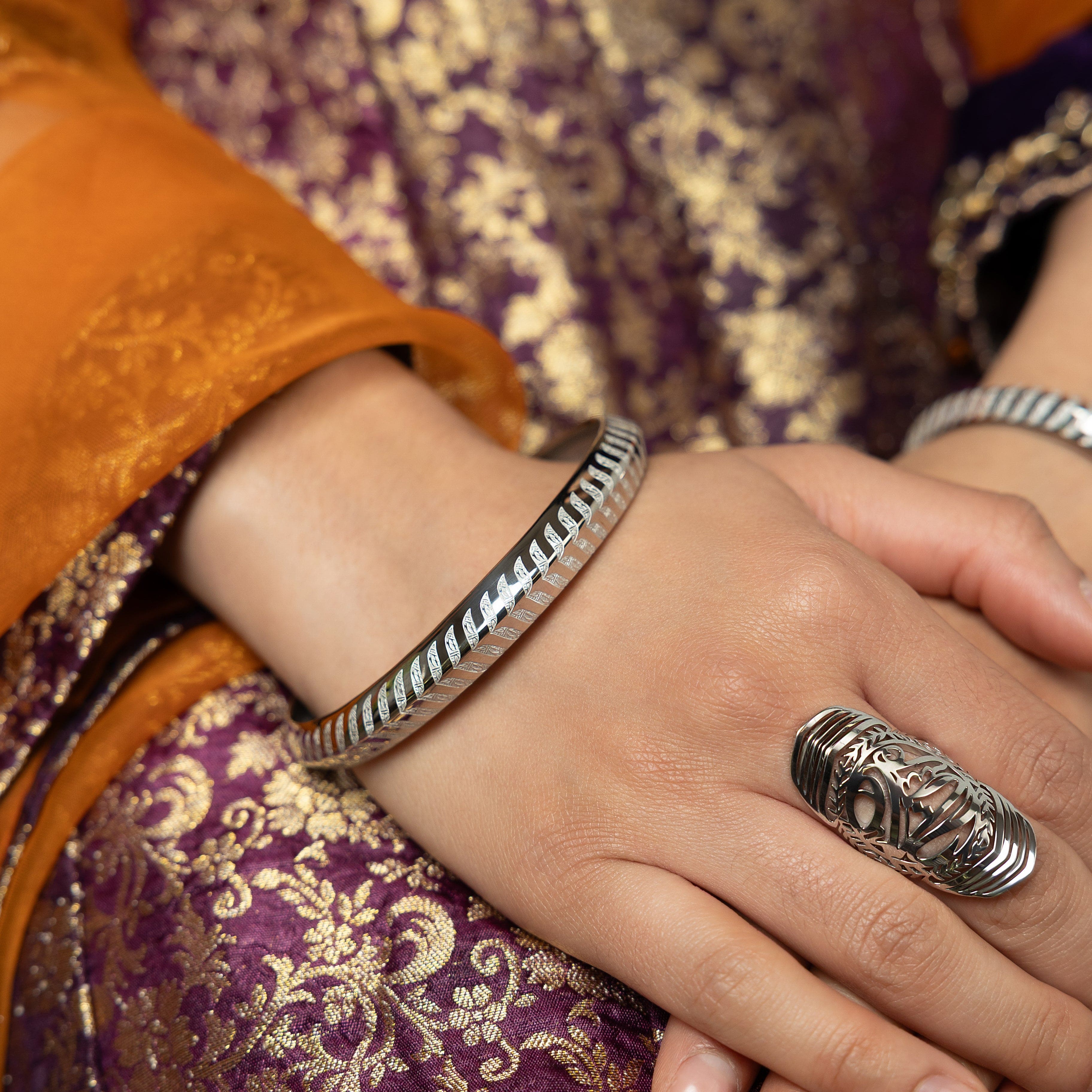 Profile view of Kun Faya Kun Gold Bangle with Arabic calligraphy