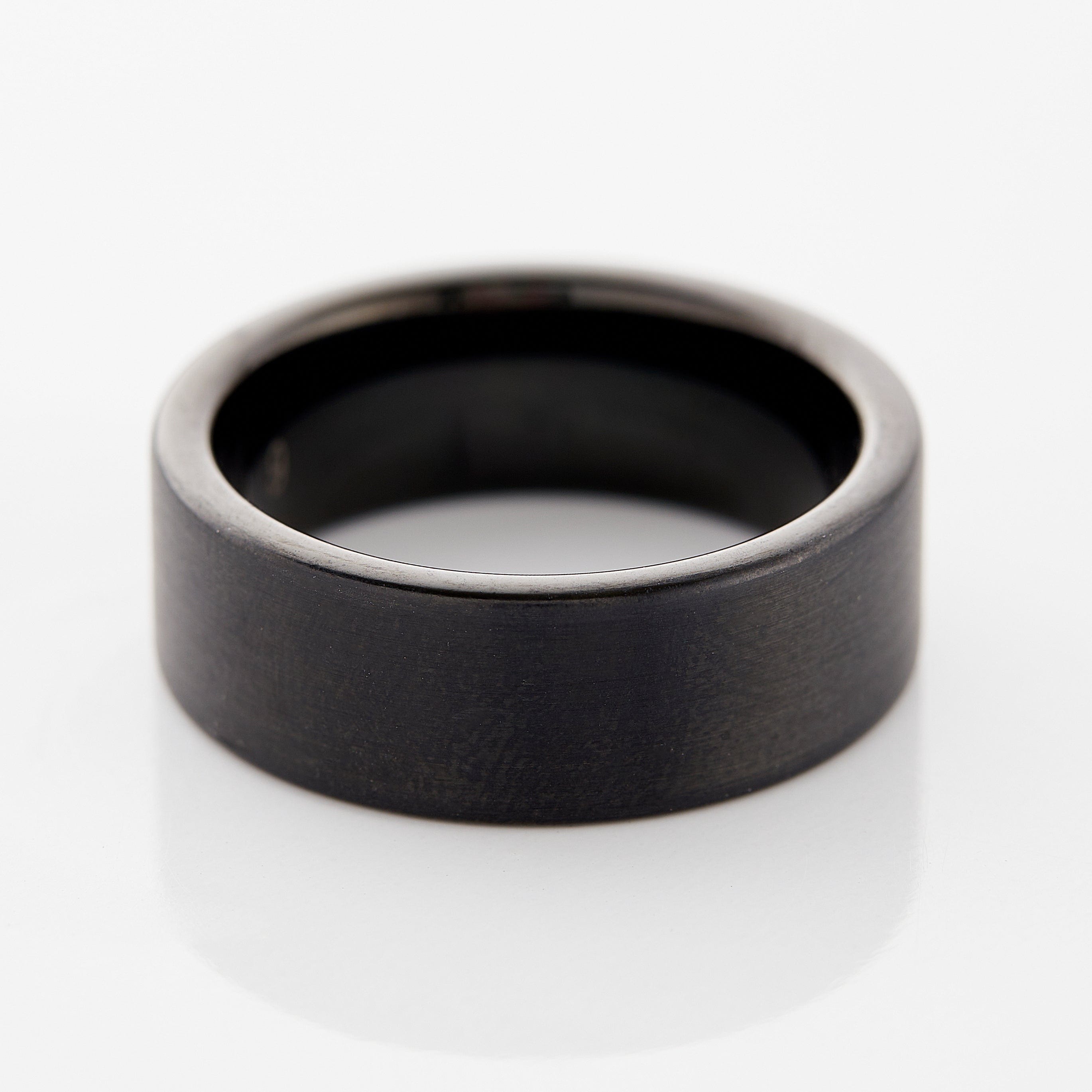 Close-up of the eternity flat tungsten ring showcasing its brushed finish.