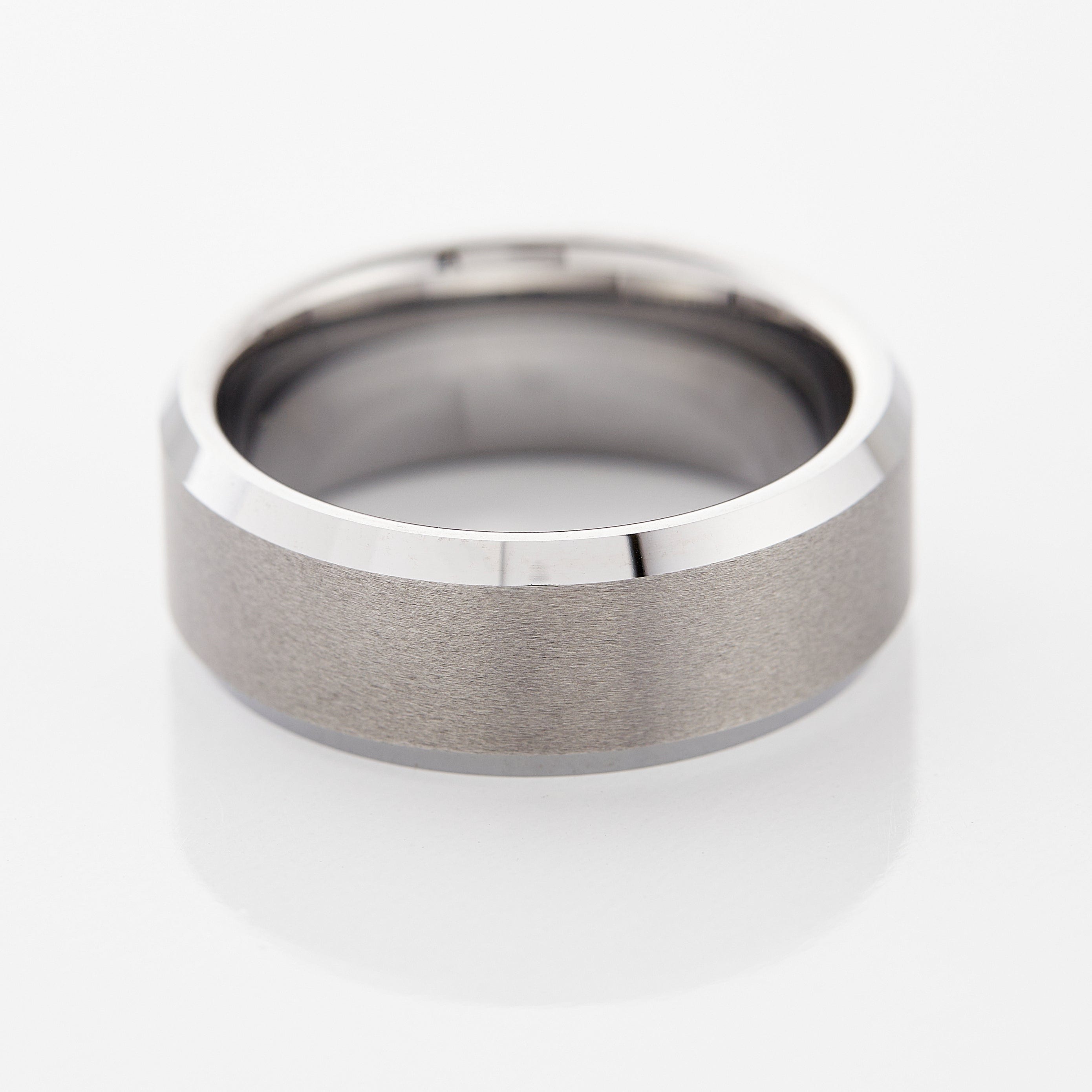 Close-up of Timeless Tungsten Mens Ring with brushed finish and glossy beveled edges.