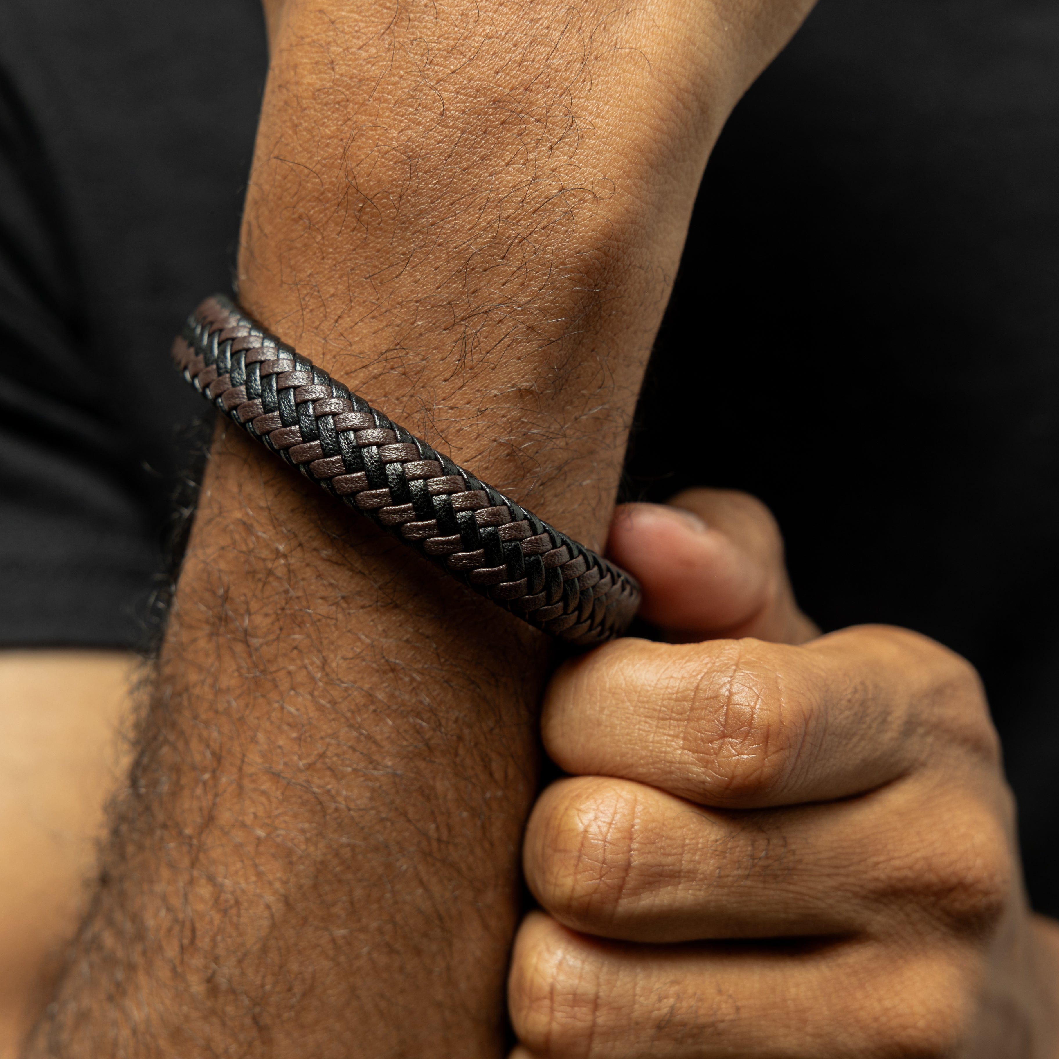 Close-up of the interwoven faux leather material, highlighting the craftsmanship of the bracelet.