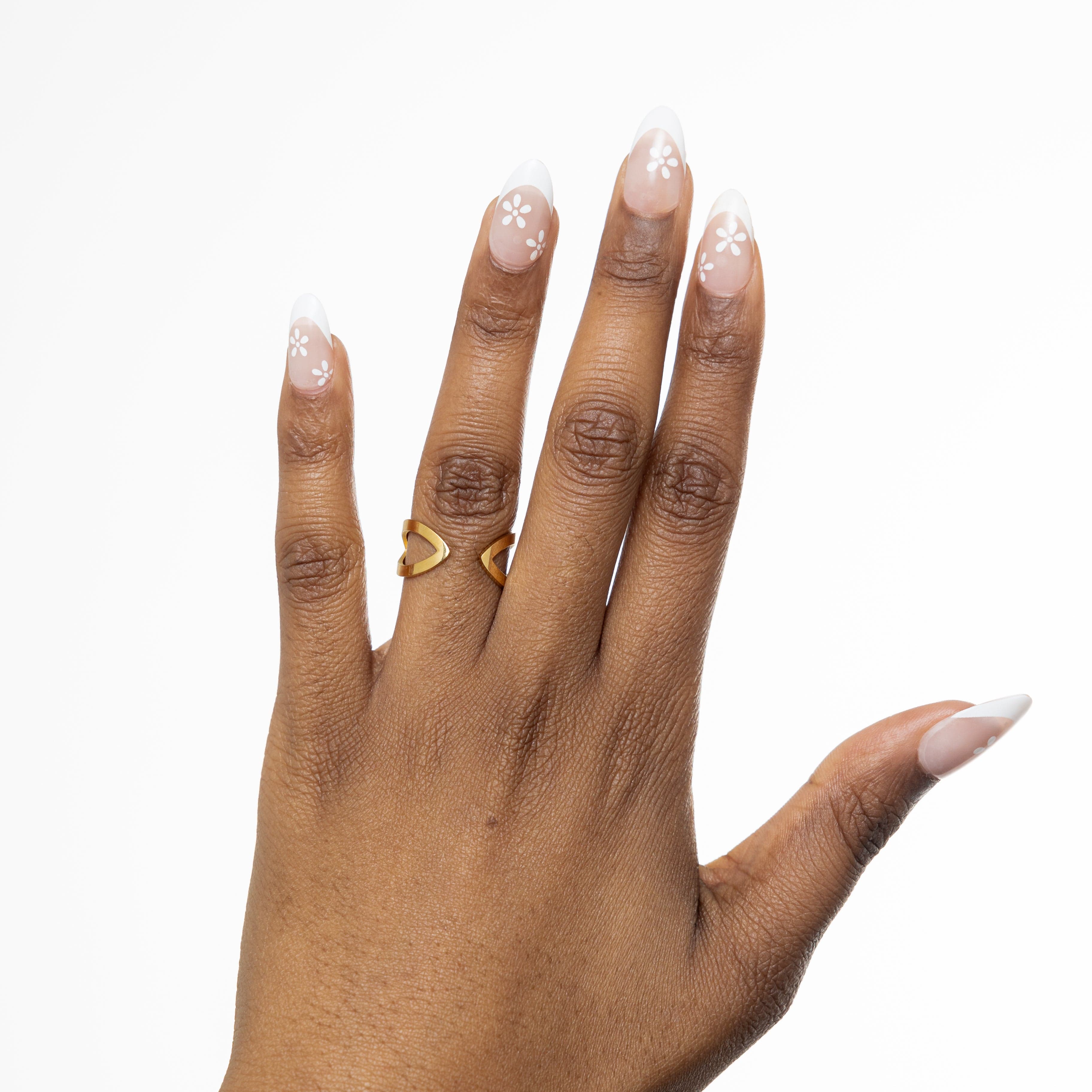 Model wearing the Corridor Elegance Ring layered with other minimalist jewelry for a chic look.