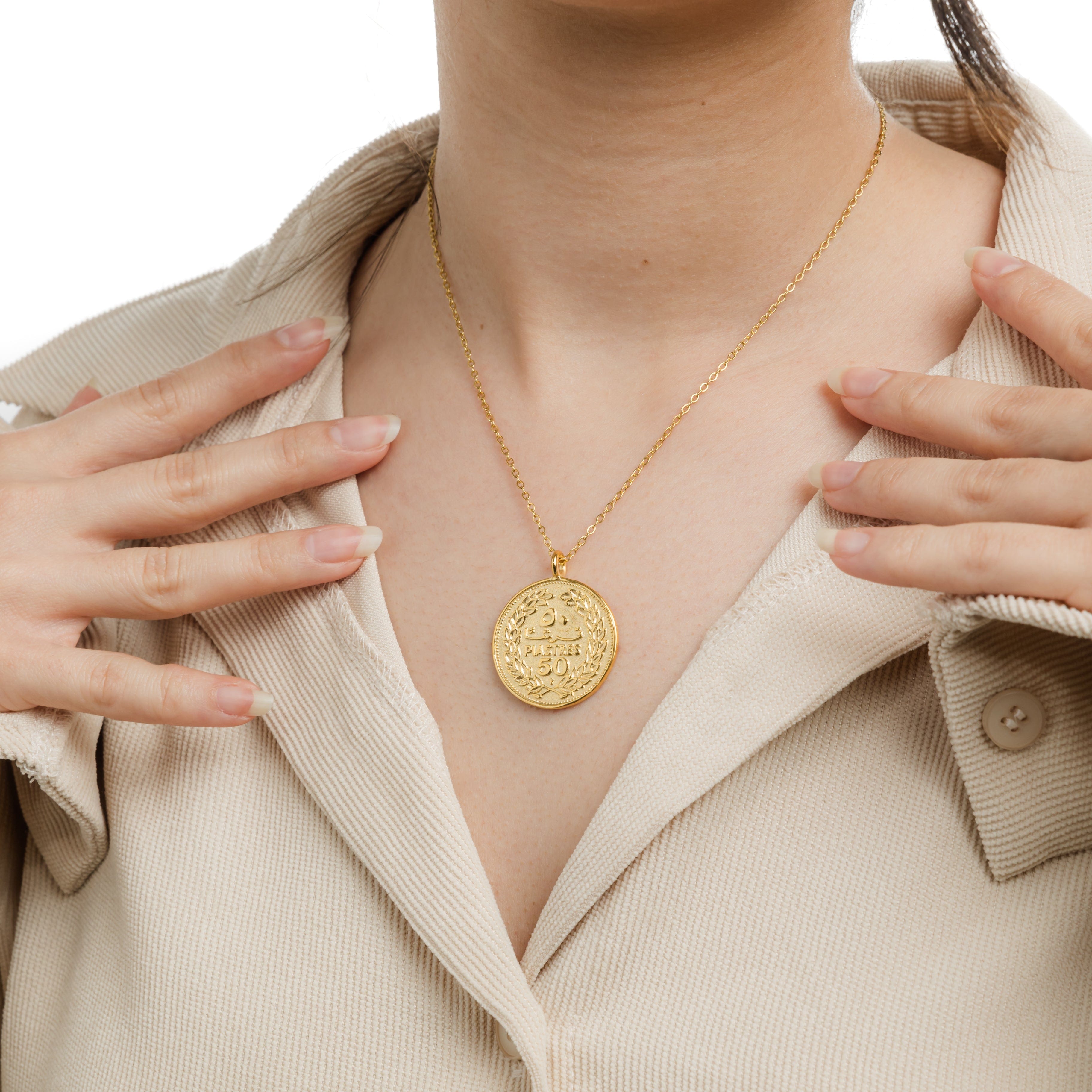 Model wearing the Heritage Coin Necklace, highlighting its elegant look and cultural significance.