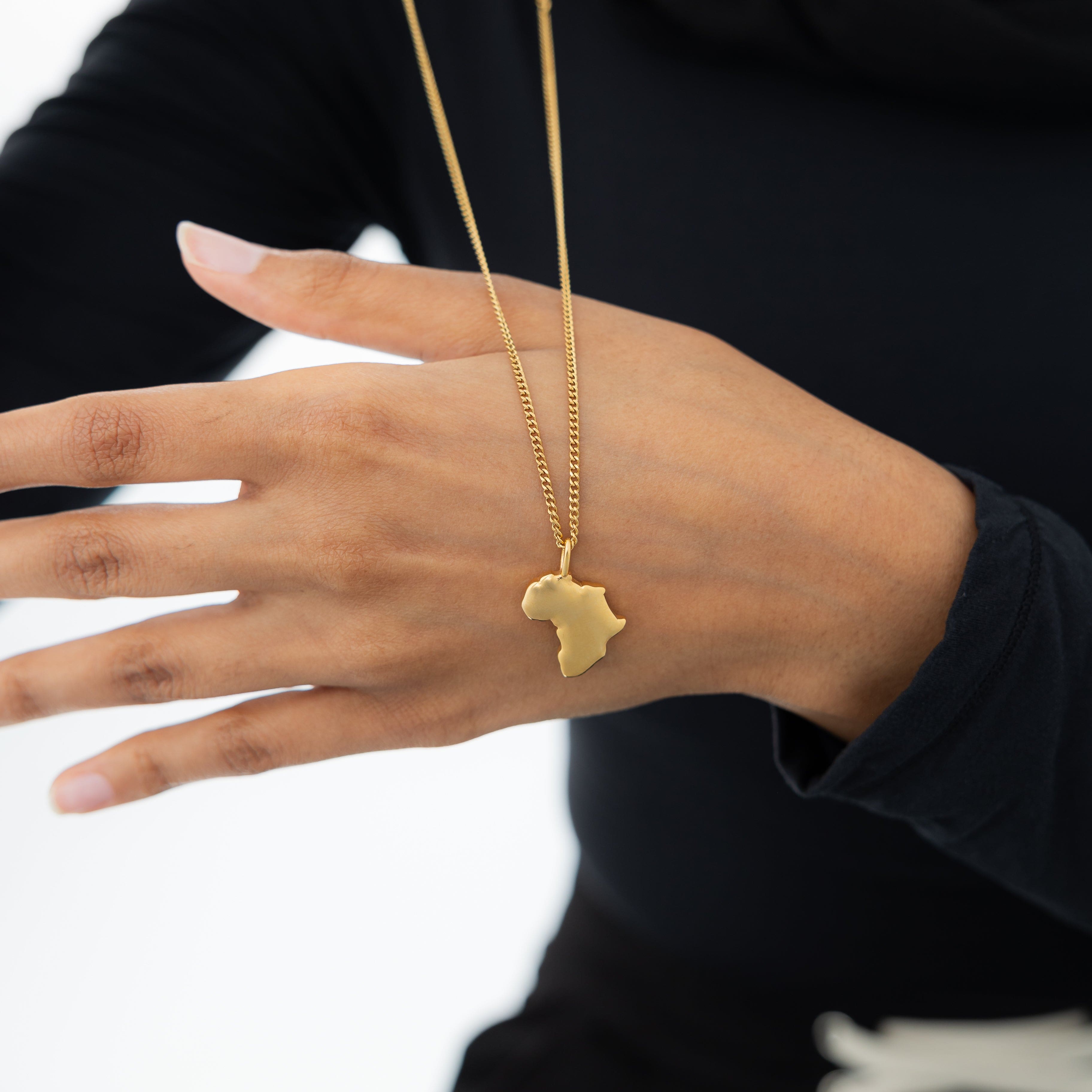 Hometown map charm in a velvet pouch, showcasing its elegant design.