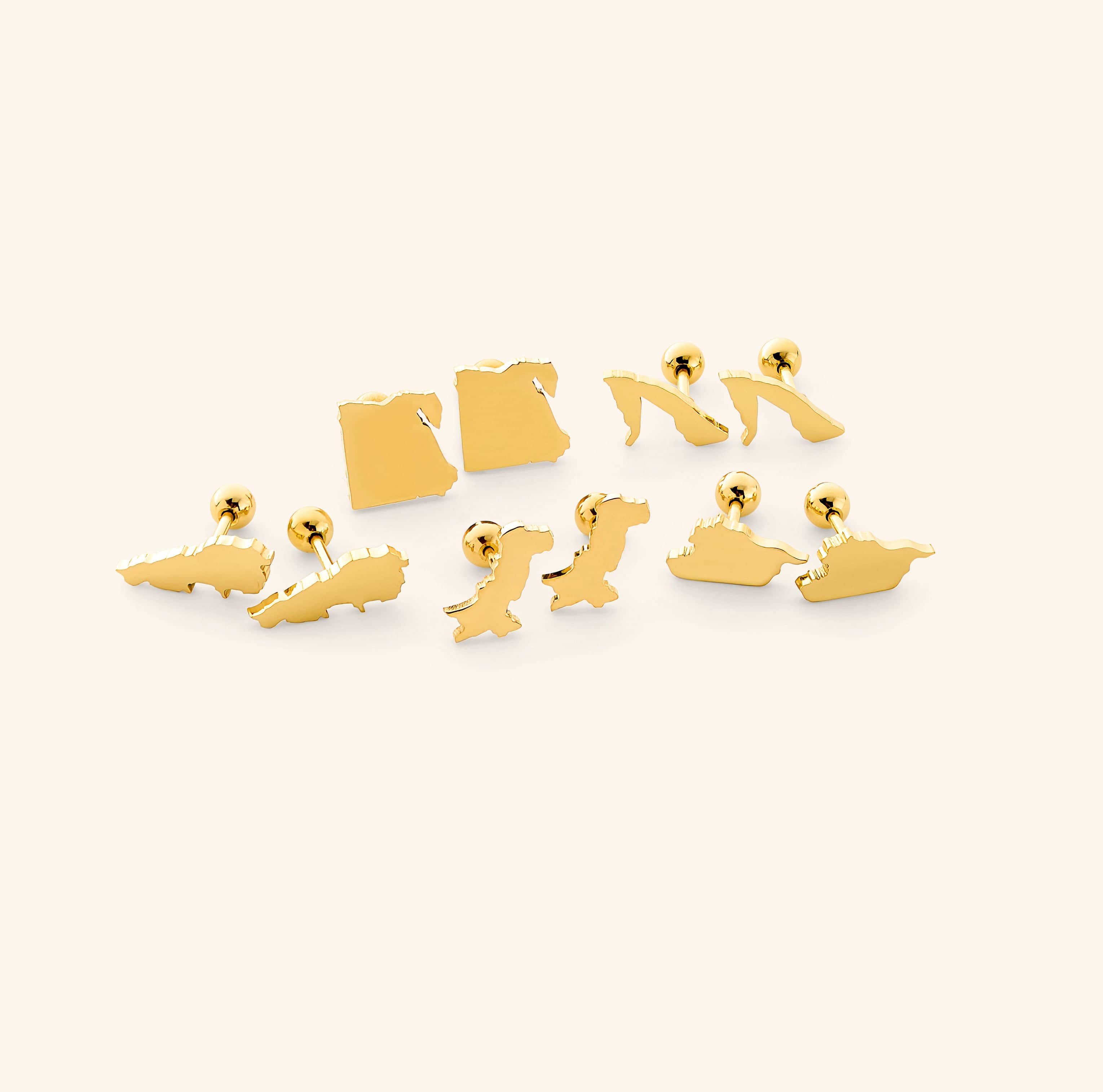 The Timeless Country Gold Stud Earrings elegantly displayed in a drawstring pouch.