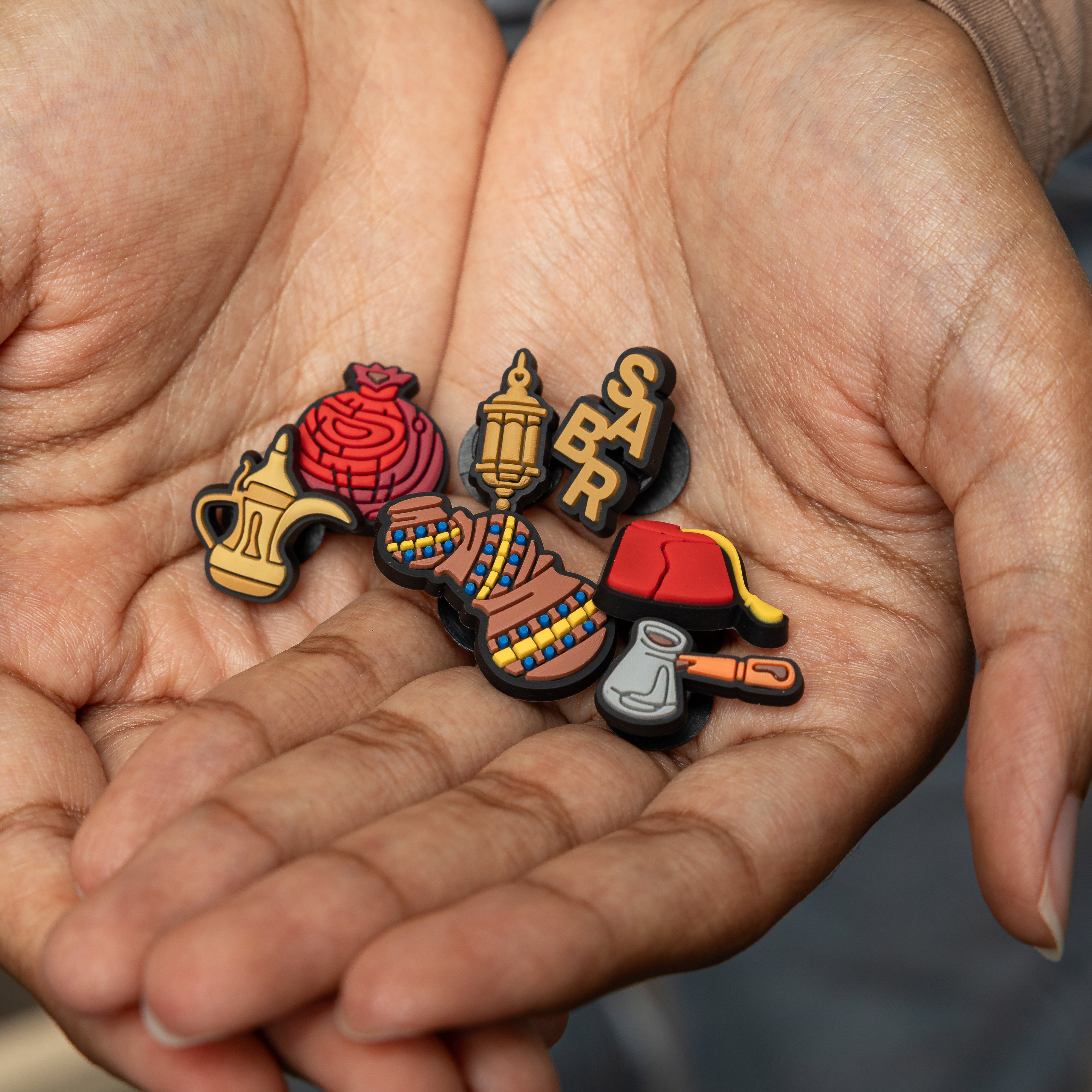 Heritage Charm Collection featuring a traditional water jug, symbolizing family gatherings.