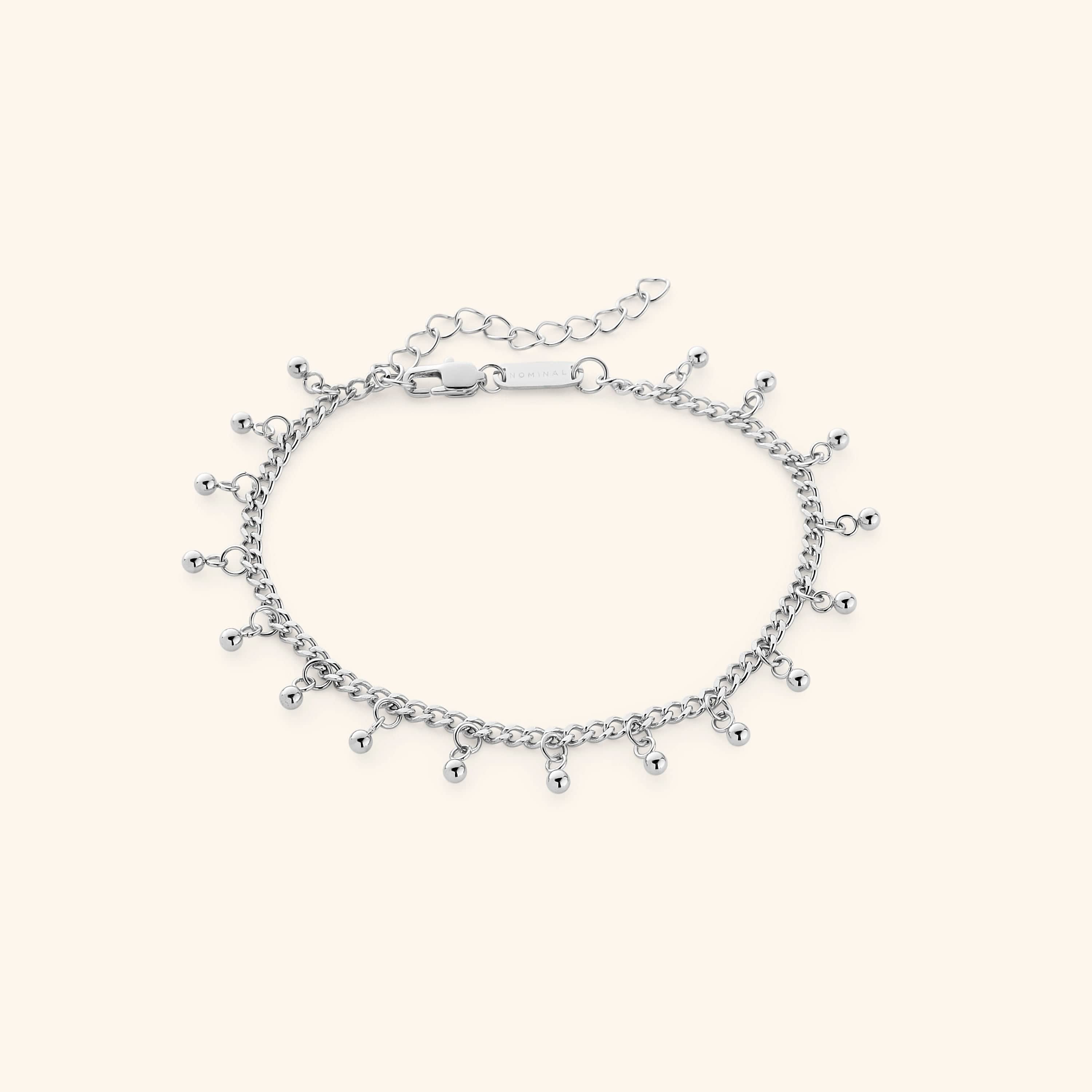 A lifestyle image of the gold anklet worn with casual attire, emphasizing its versatility.