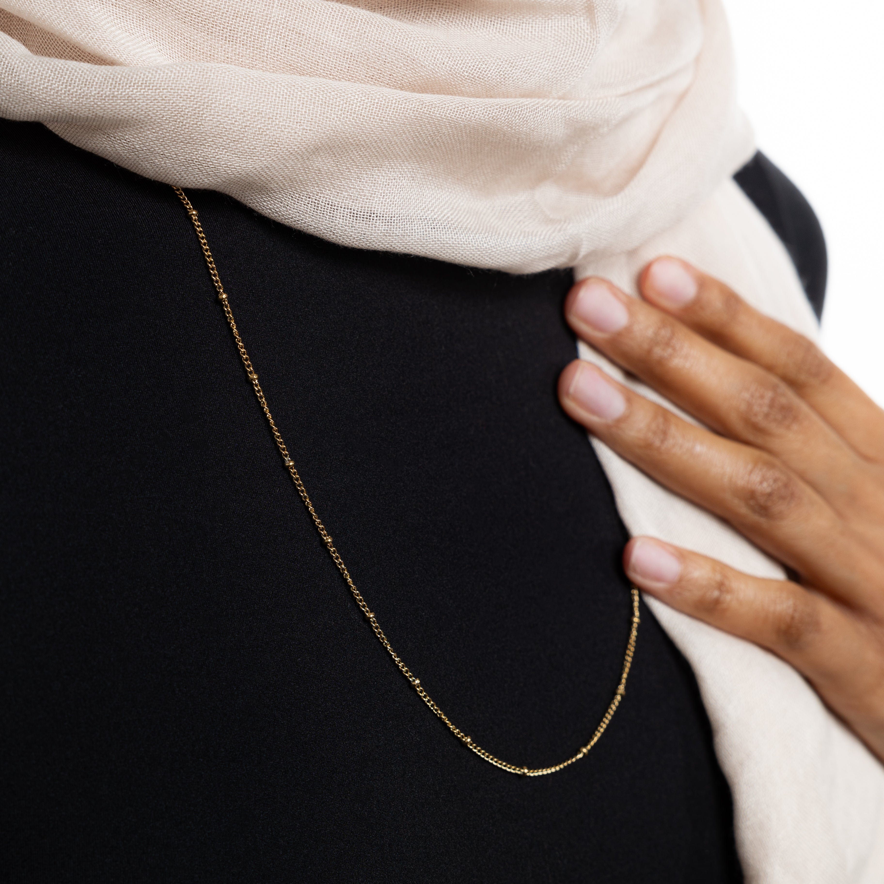 Close-up of the 2mm cable chain of the Dotted Gold Chain Necklace, highlighting its quality.