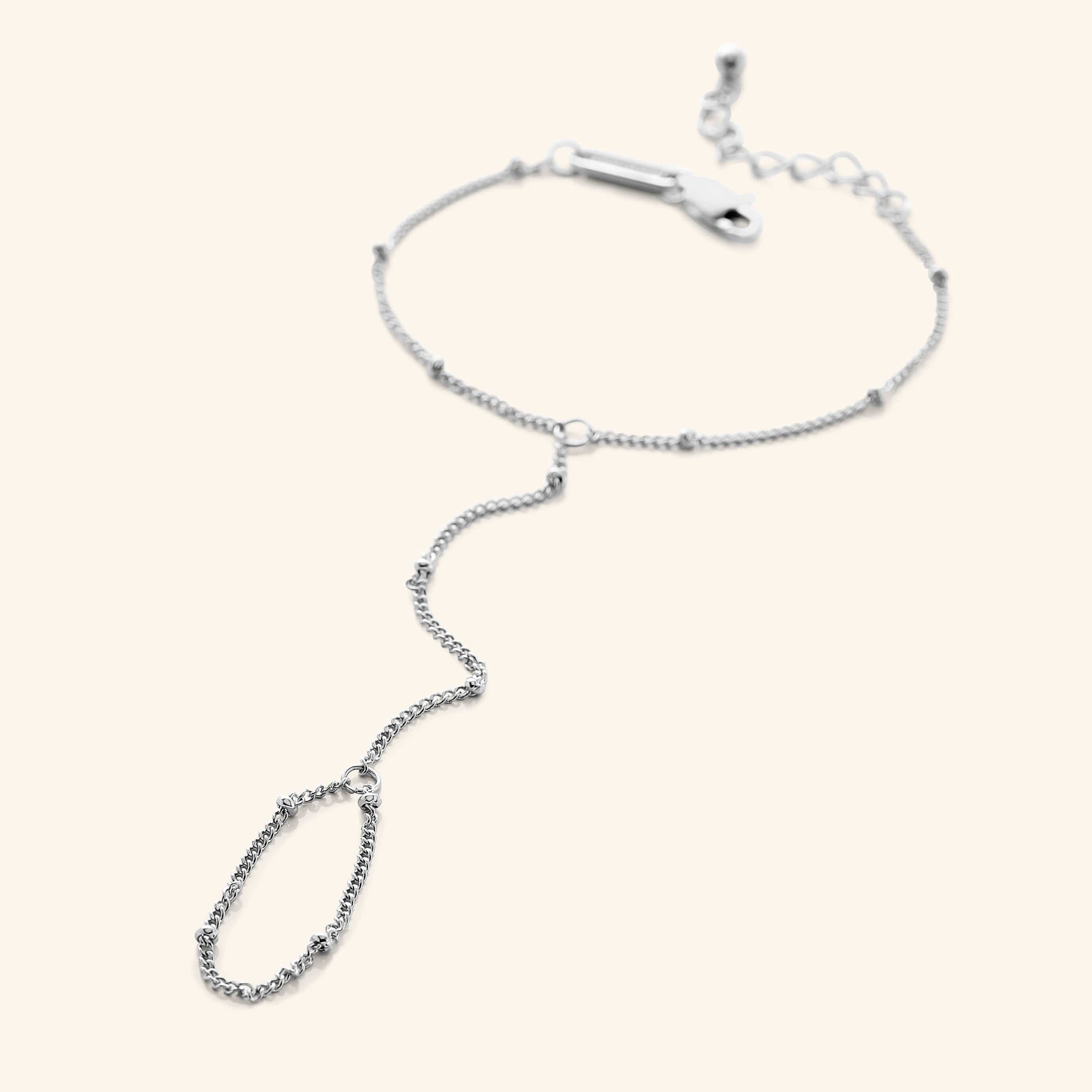 Model wearing the stylish dotted hand chain, highlighting its versatility for casual and formal outfits.