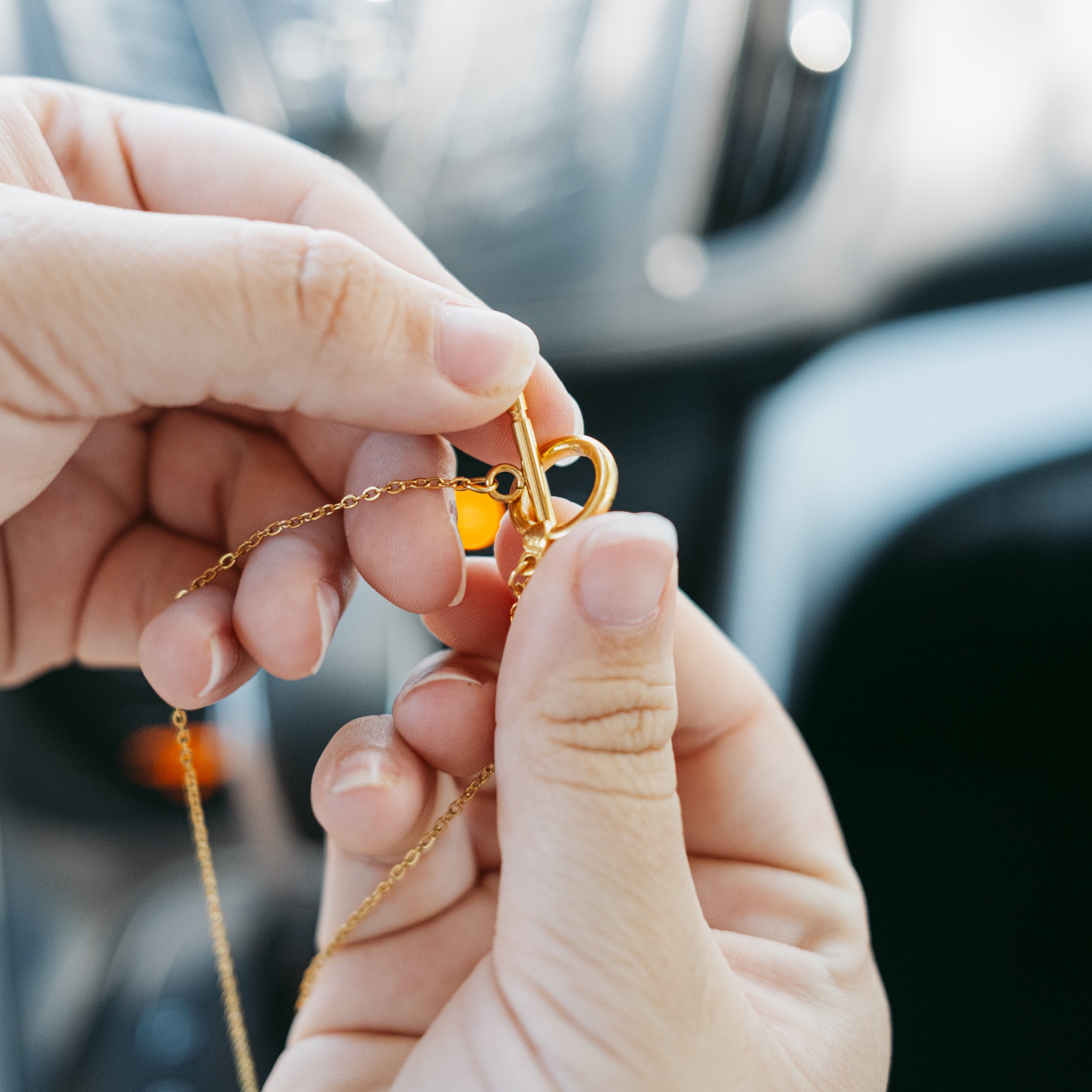 Travel prayer car hanger in its velvet pouch, highlighting its elegant presentation as a religious gift.