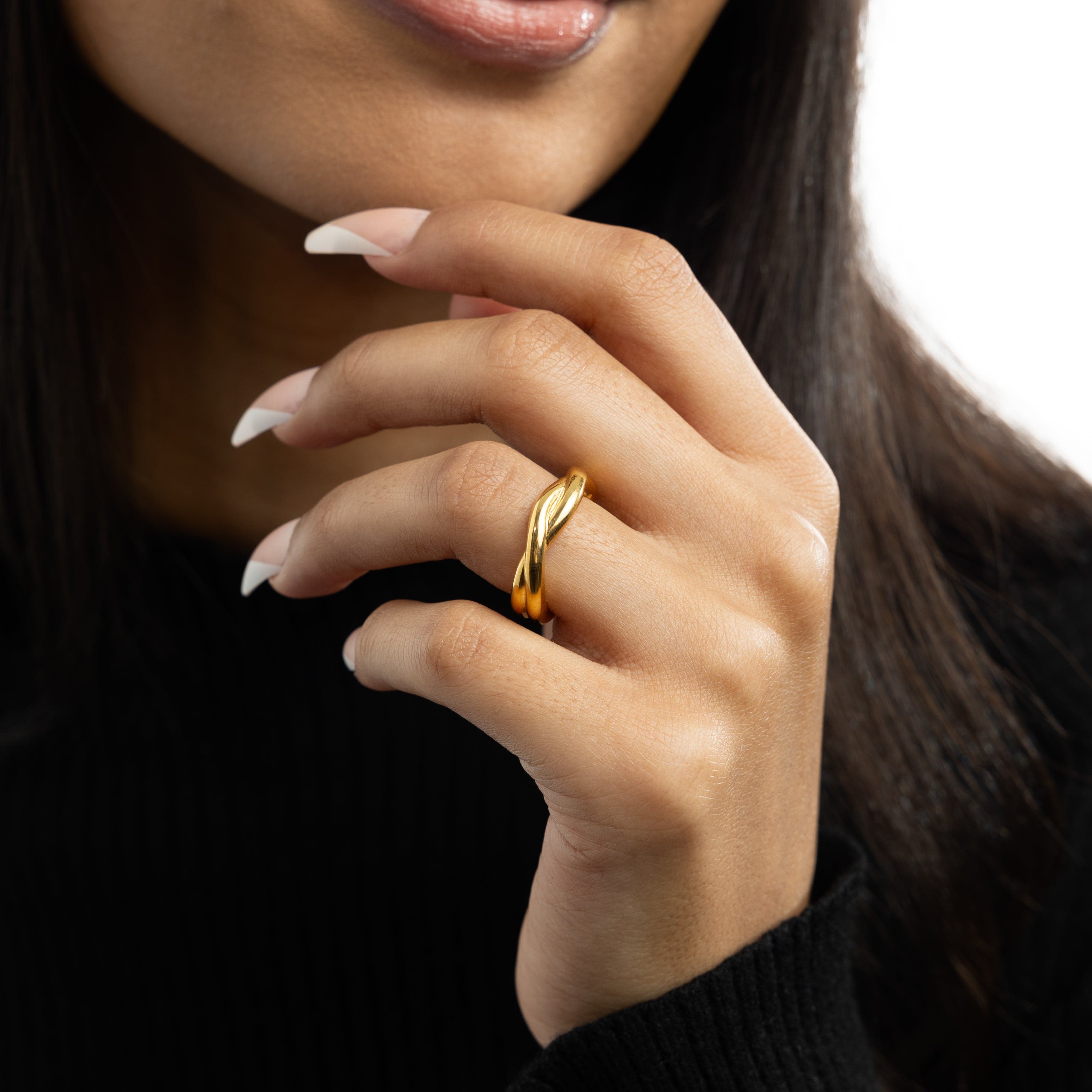 Couple wearing Intertwined Love Rings in casual outdoor setting.