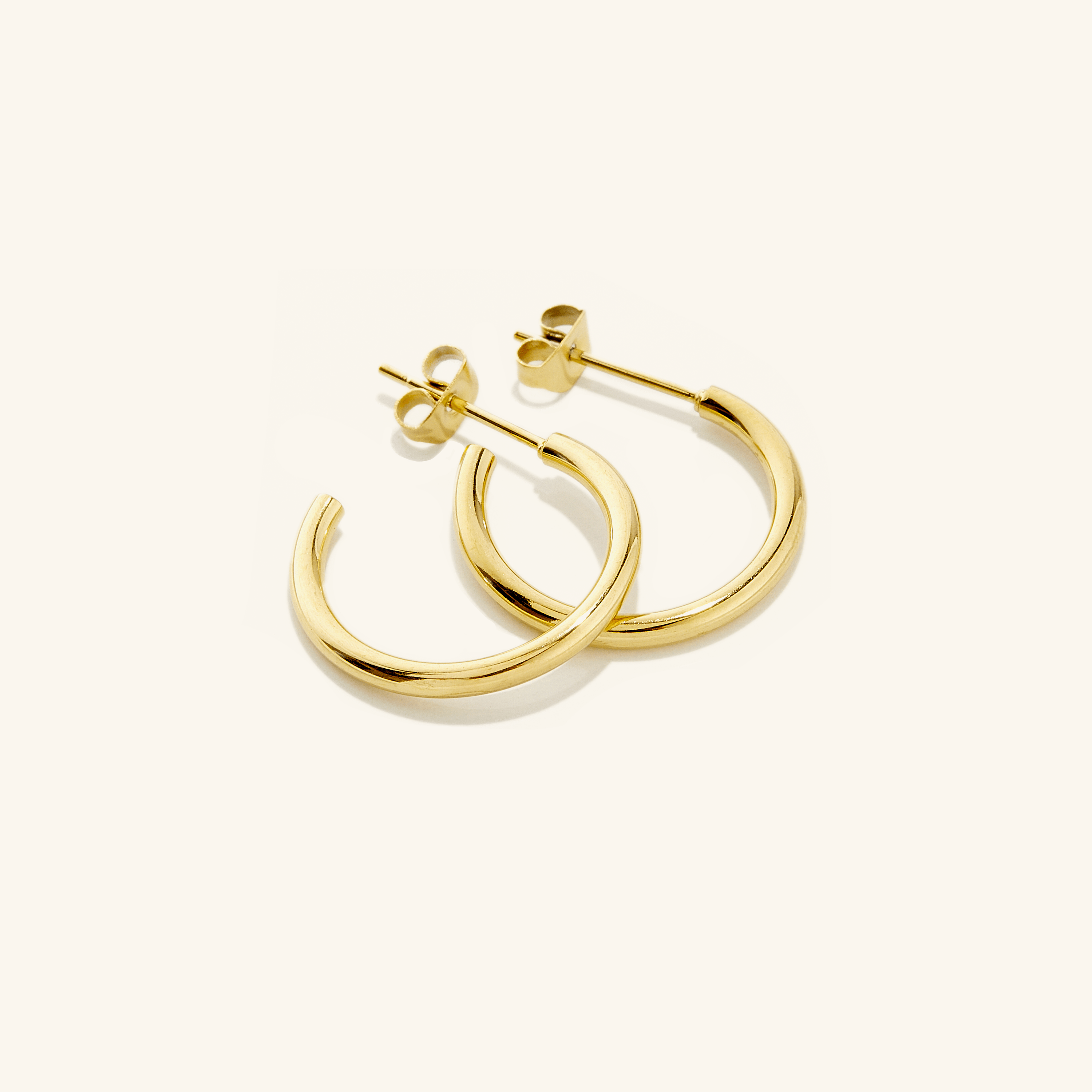 Front view of Everyday Luxe 18mm gold hoop earrings showcasing their shine.